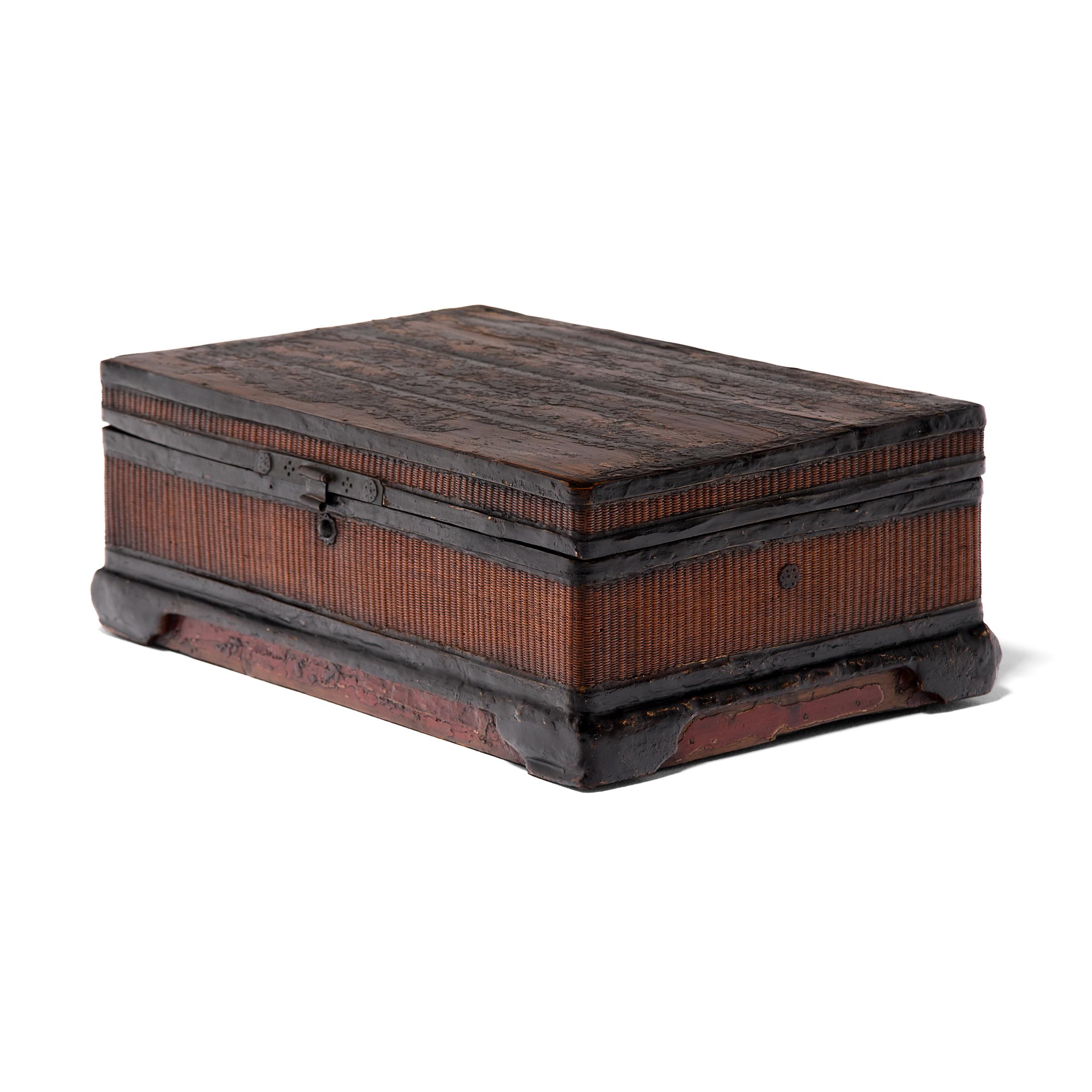This finely woven circa 1800 trunk is a work of art in itself and was possibly used to store prized painted scrolls. A skilled artisan painstakingly wove thin-as-hair reeds to cover each panel. The top is fully detachable and maintains its original
