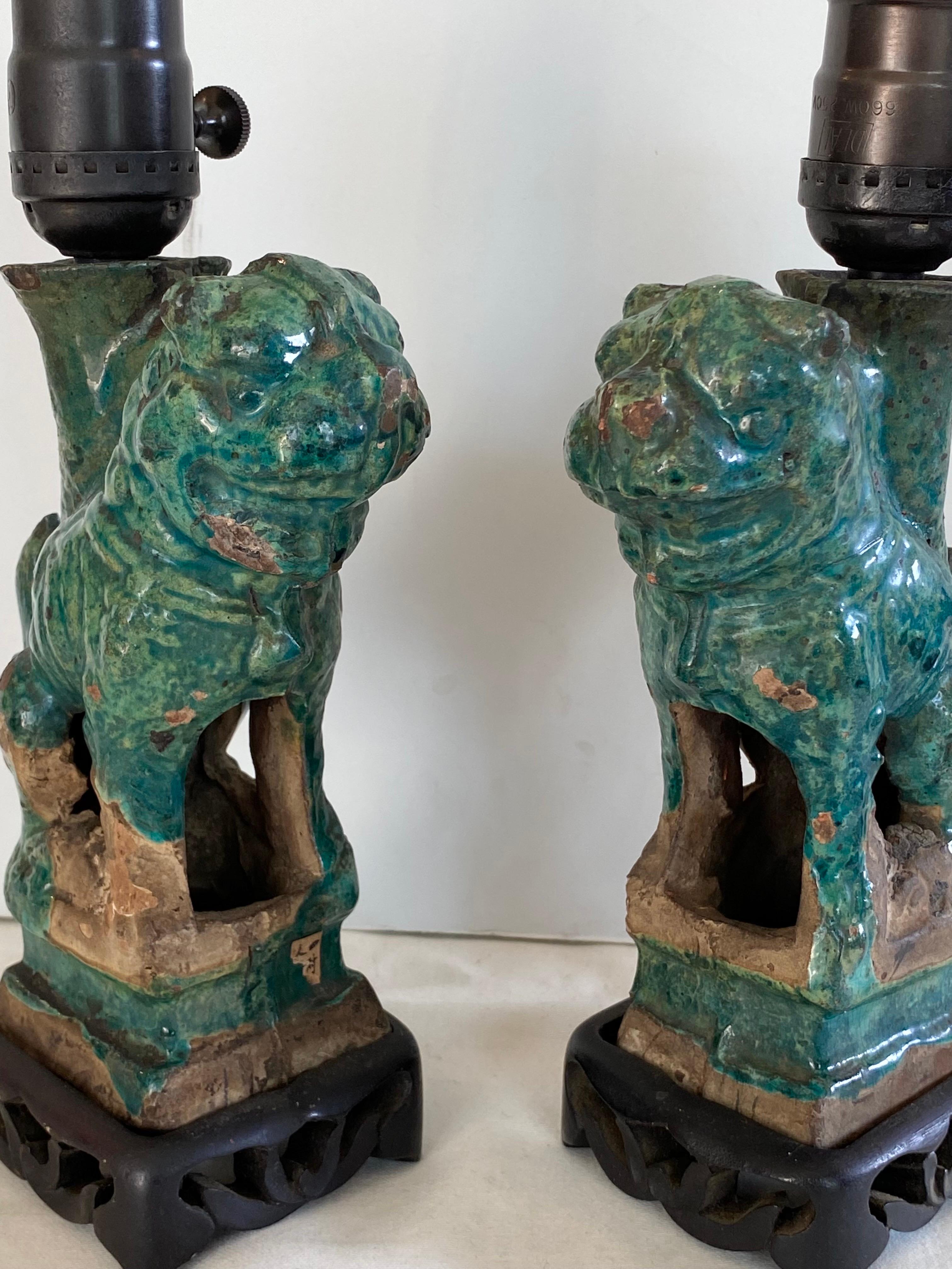 Petit pair of green ceramic foo dogs as lamps.....newly rewired and fitted with bronze hardware.