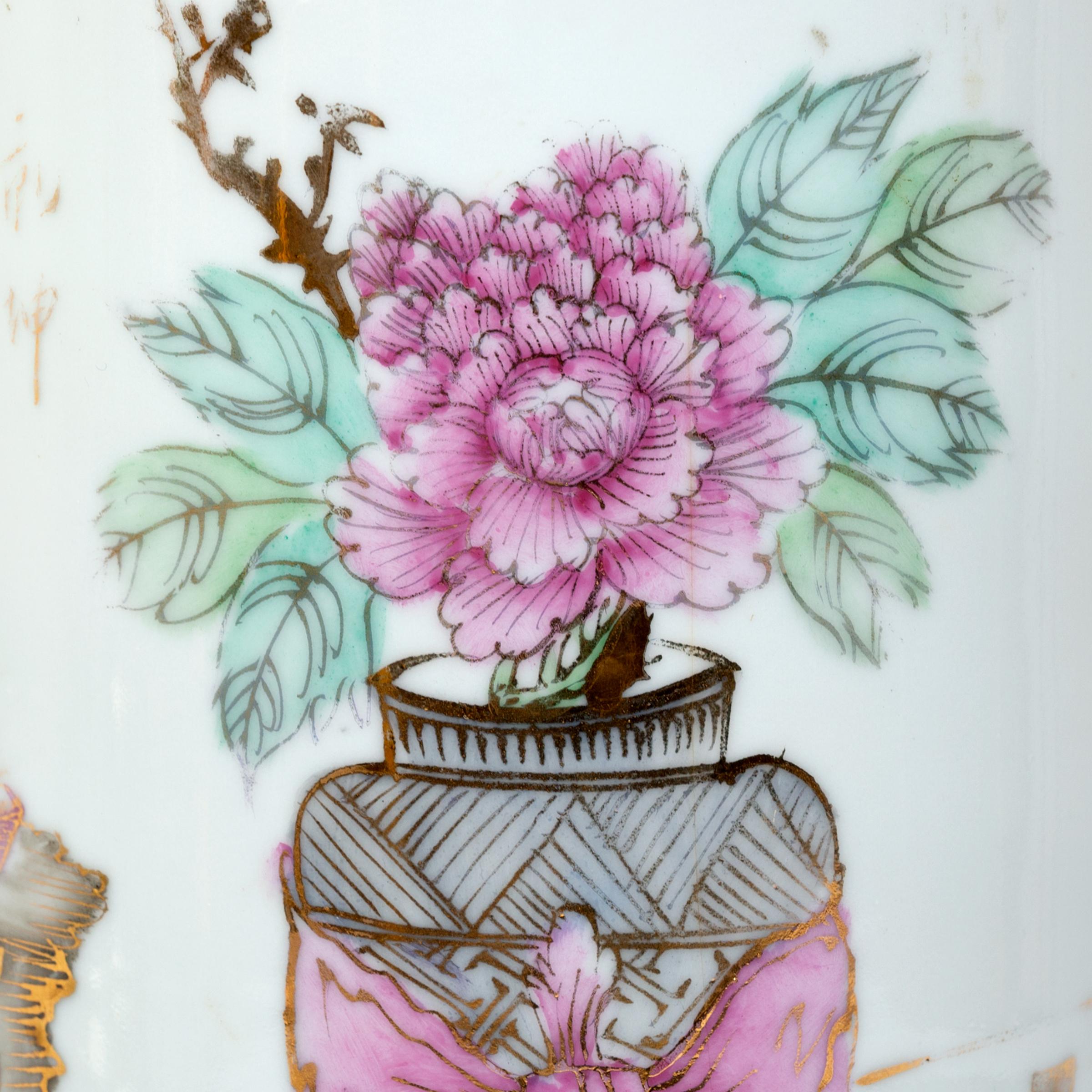 Adorned with the prized collection of a Qing-dynasty scholar, this straight, cylindrical vase is decorated with an array of treasured items. Beautifully painted with a skilled hand, the porcelain vase celebrates the springtime with a lush peony