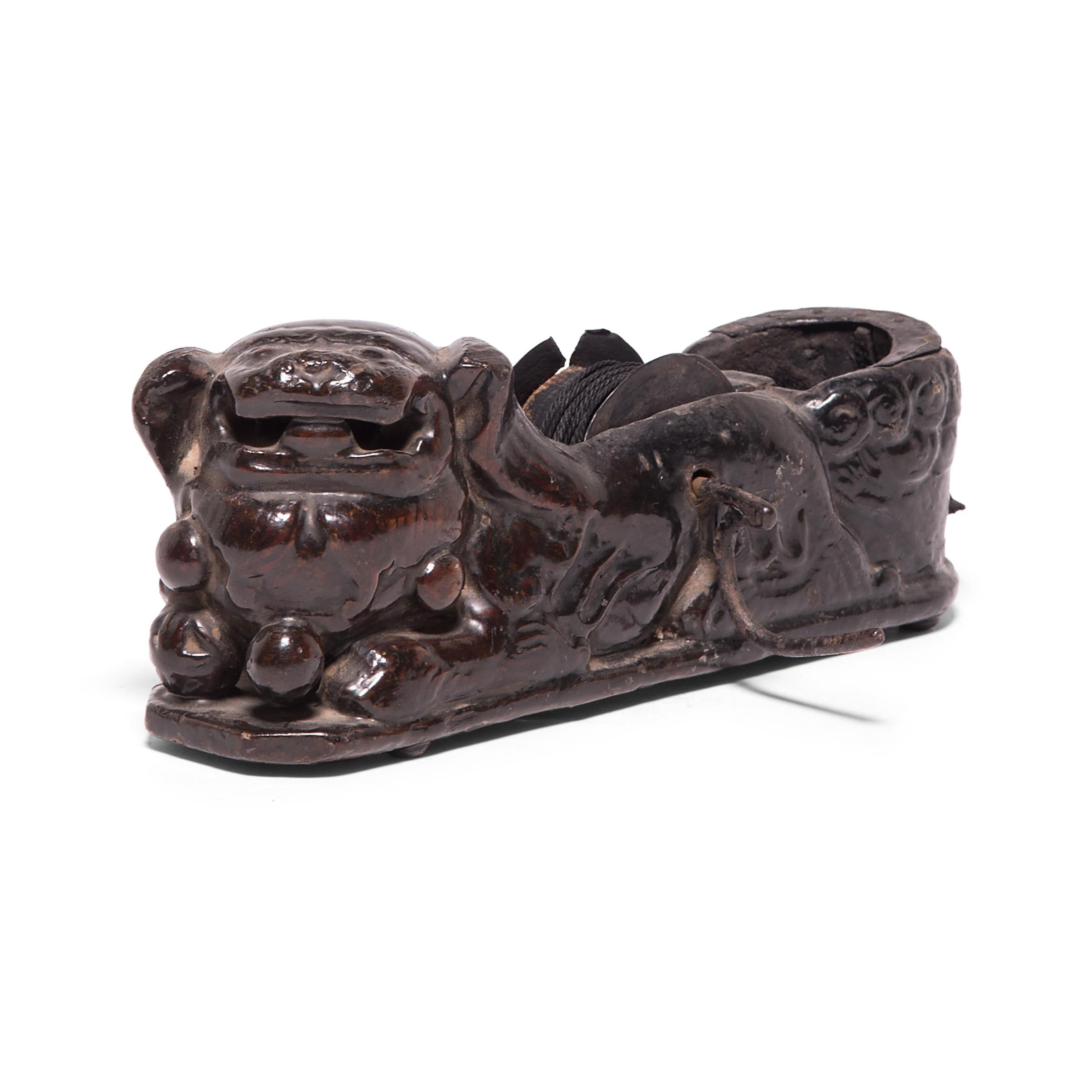 Given the beauty and thoughtful design of traditional Chinese furniture, it’s no wonder that Qing-dynasty carpenter’s tools were accorded the same attention to detail. This remarkably intact 19th century inkline reel is carved to depict a guardian