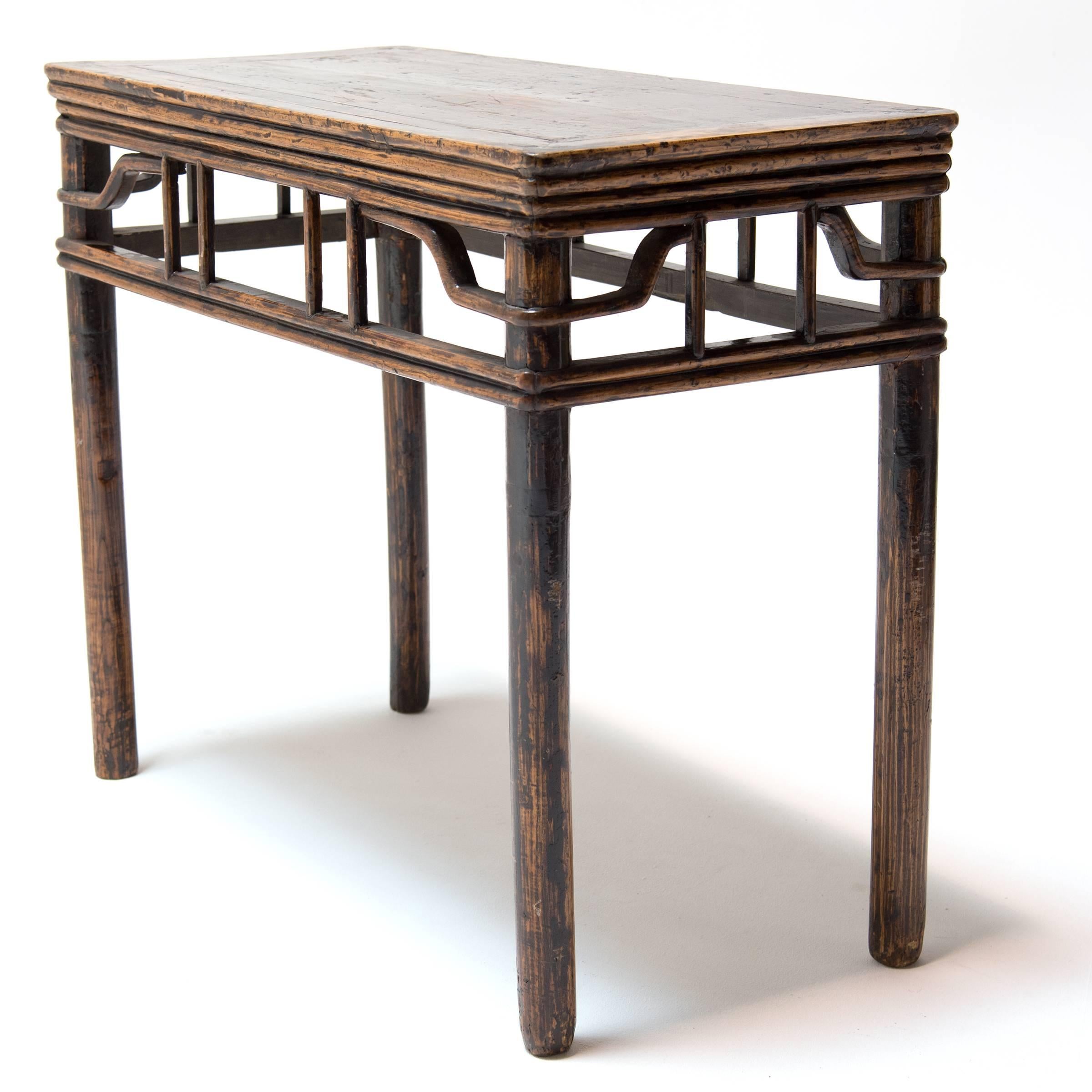 This 19th century side table hand-crafted in China’s Shanxi Province has an understated beauty common in the best pieces of classical Chinese furniture. It has beautiful proportions, and an elegant, almost modern, simplicity. The lattice-like apron