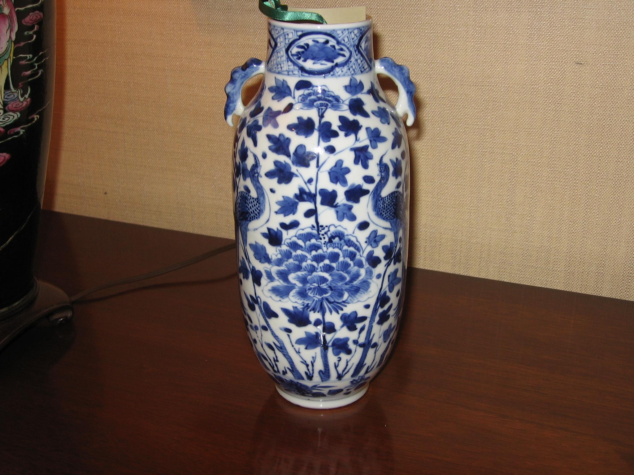 19th century Chinese hand painted Blue & White porcelain vase with interesting symmetrical pattern.
