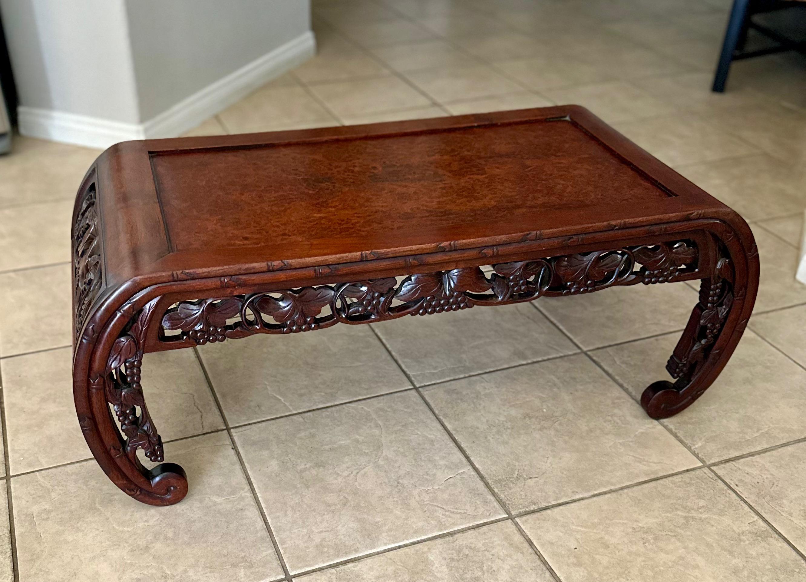 Late 19th century Chinese Asian hardwood low opium coffee table. Well crafted with beautiful oystered pattern veneer top, curved legs and carved pierced frieze throughout.  