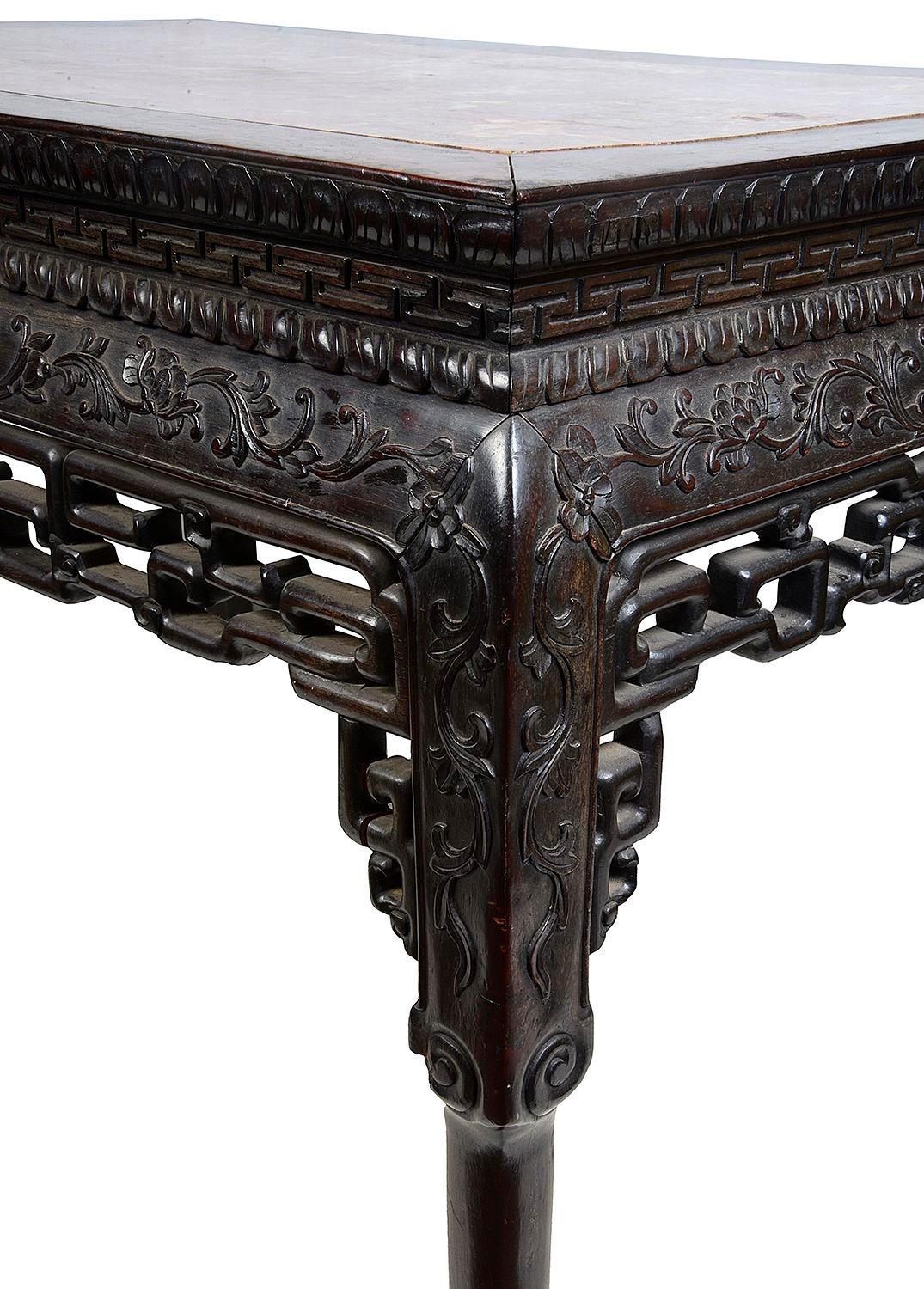 A good quality 19th Century Chinese hardwood side table. having its original inset marble top, classical hand carved scrolling foliate decoration to the frieze, with pierced fretwork to the apron around. Raised on elegant carved legs terminating in