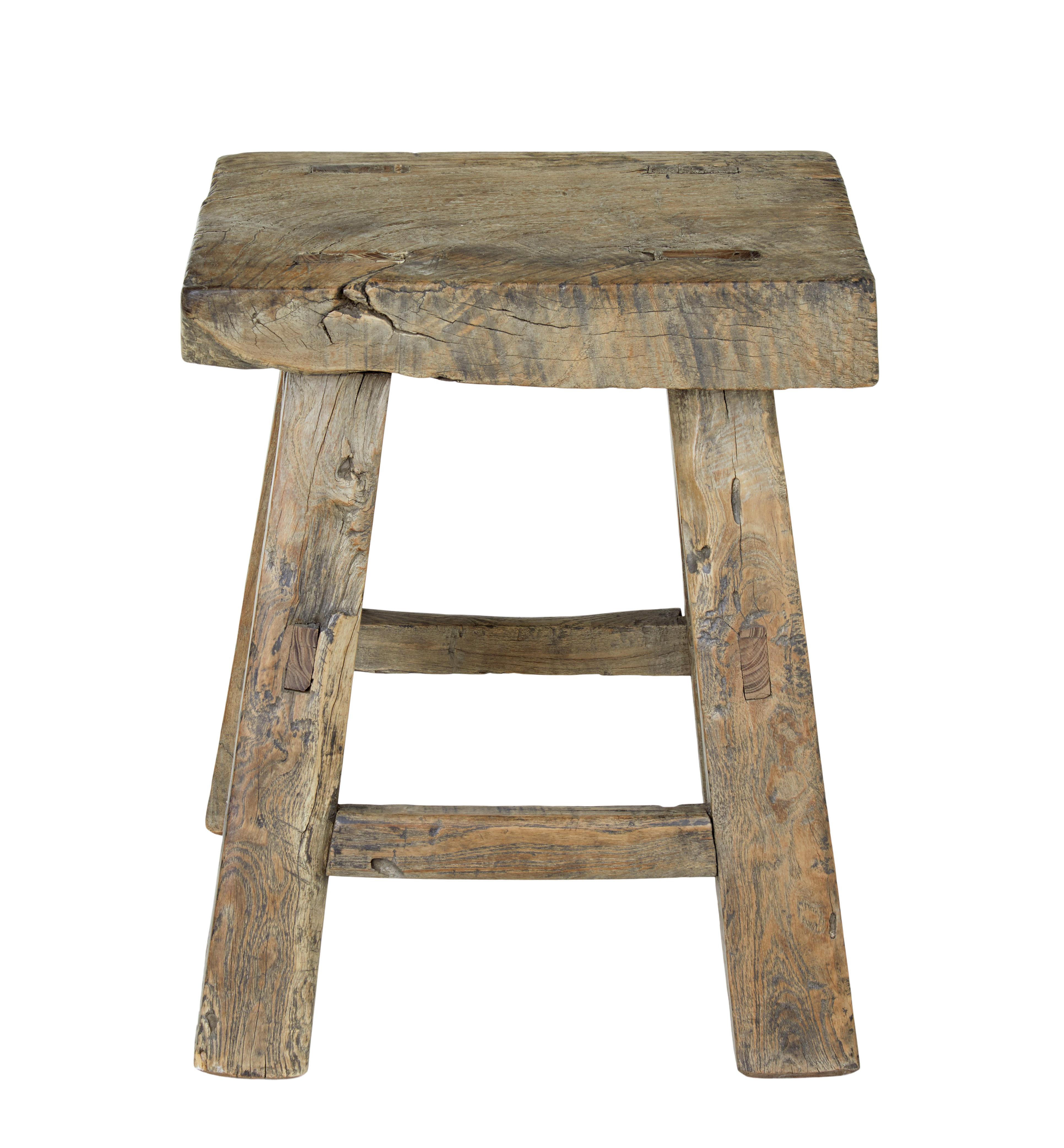 Rustic traditional Chinese elm stool, circa 1890.

Made using naive mortise and Tenon joints, provide great character for this stool. Expected age splits and surface marks, structurally sound.

Heavy item for its size.

Measures: Seat depth