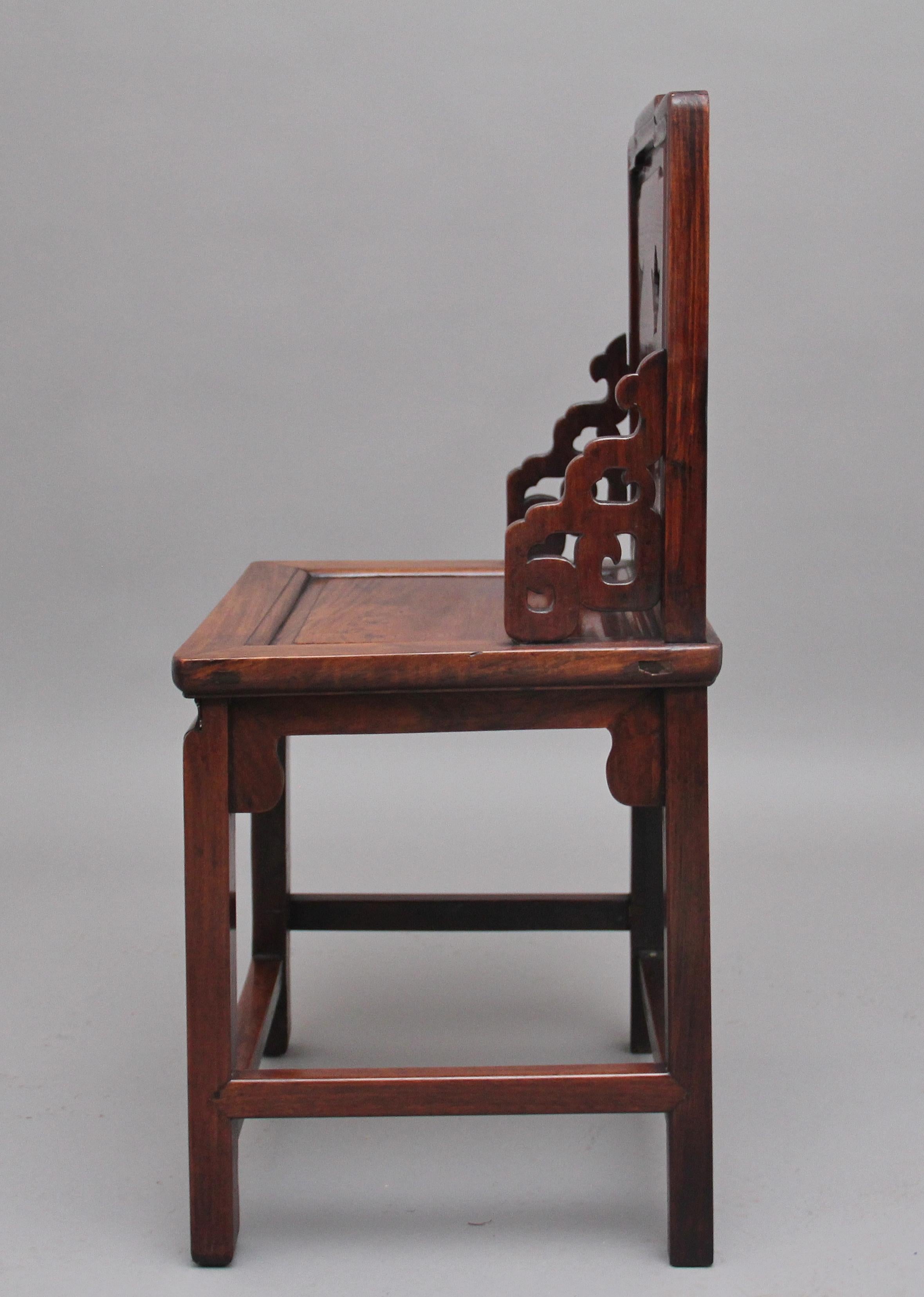 An unusual and rare 19th century Chinese carved hongmu hardwood chair with marble inset, the shaped and moulded back with three decorative cut out shapes of two vases and a teapot, each with a marble inset, carved and shaped corner brackets, nice