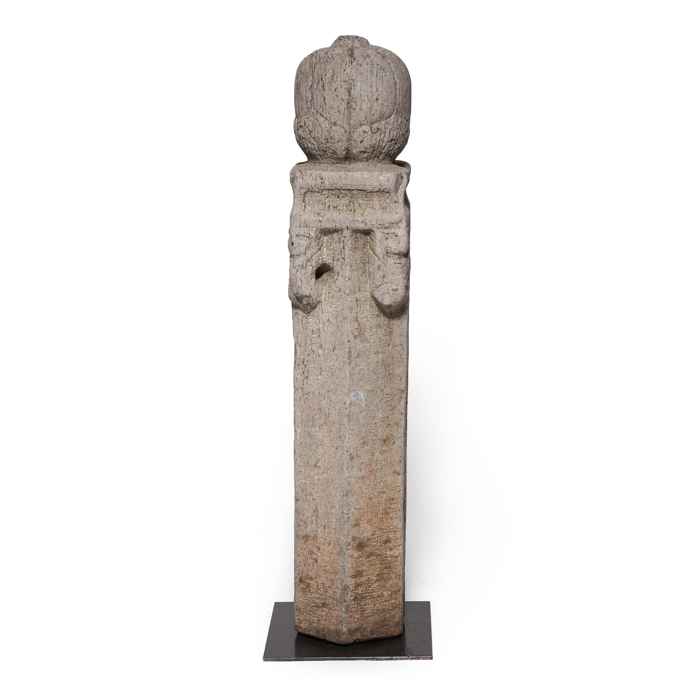 Plain wooden hitching posts have been used for centuries to secure horses. But during the Ming and Qing dynasties families showed off their wealth by displaying beautiful stone posts, like this, which is carved in the shape of a pumpkin. This post
