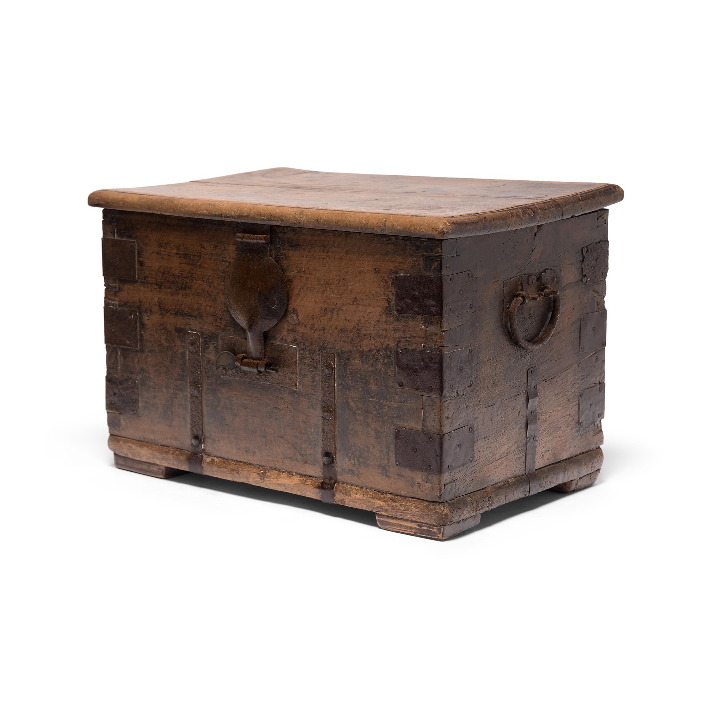 This richly aged early 19th century keeper's chest is from Shanxi province, China and would have been used to safely store one's valuables. The original hand forged iron hardware was designed exclusively for function, but we love the way it