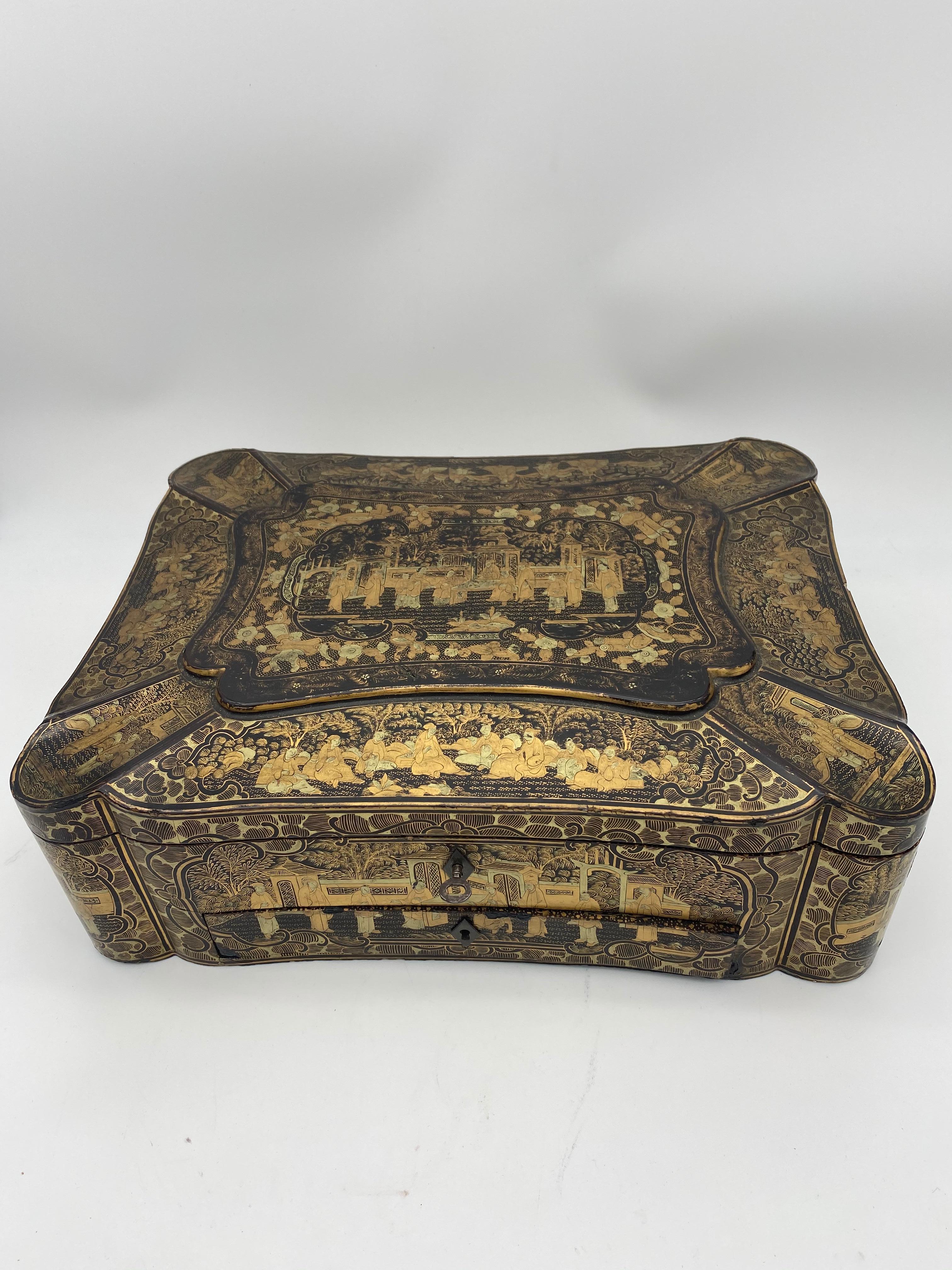  Big beautiful lacquered chinese sewing box from the 19th century of the Qing dynasty .it is a 14 inch wide big sewing box , Decorated all-over with intricate depictions of ancient Chinese people. Includes key. condition is very good , you can see