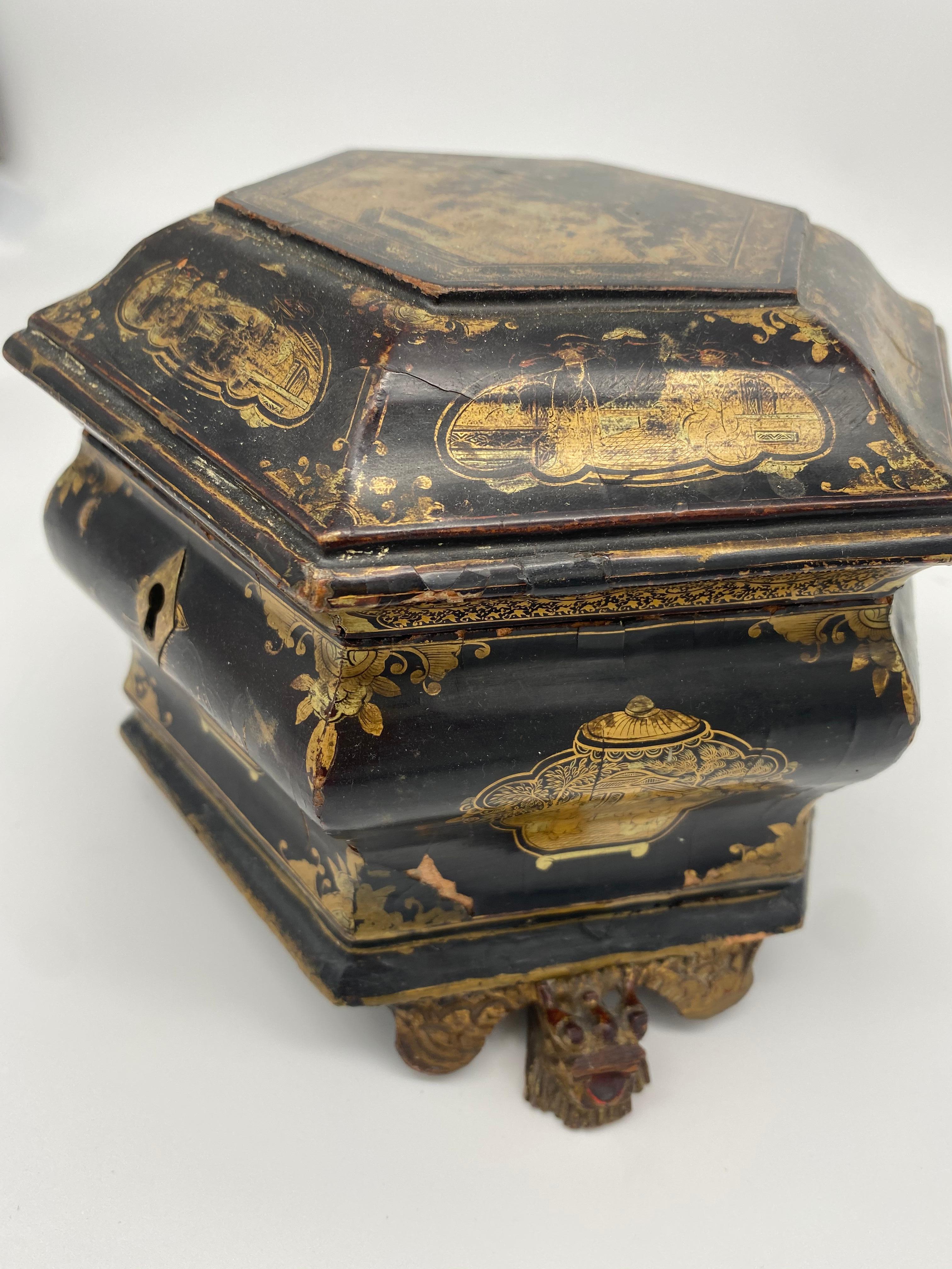 19th century Qing Dynasty Chinese export gilt decorated black lacquer tea caddy. Hexagonal shape with floral chased pewter covered caddies detailed in gold and black. there are 3 dragon feets !