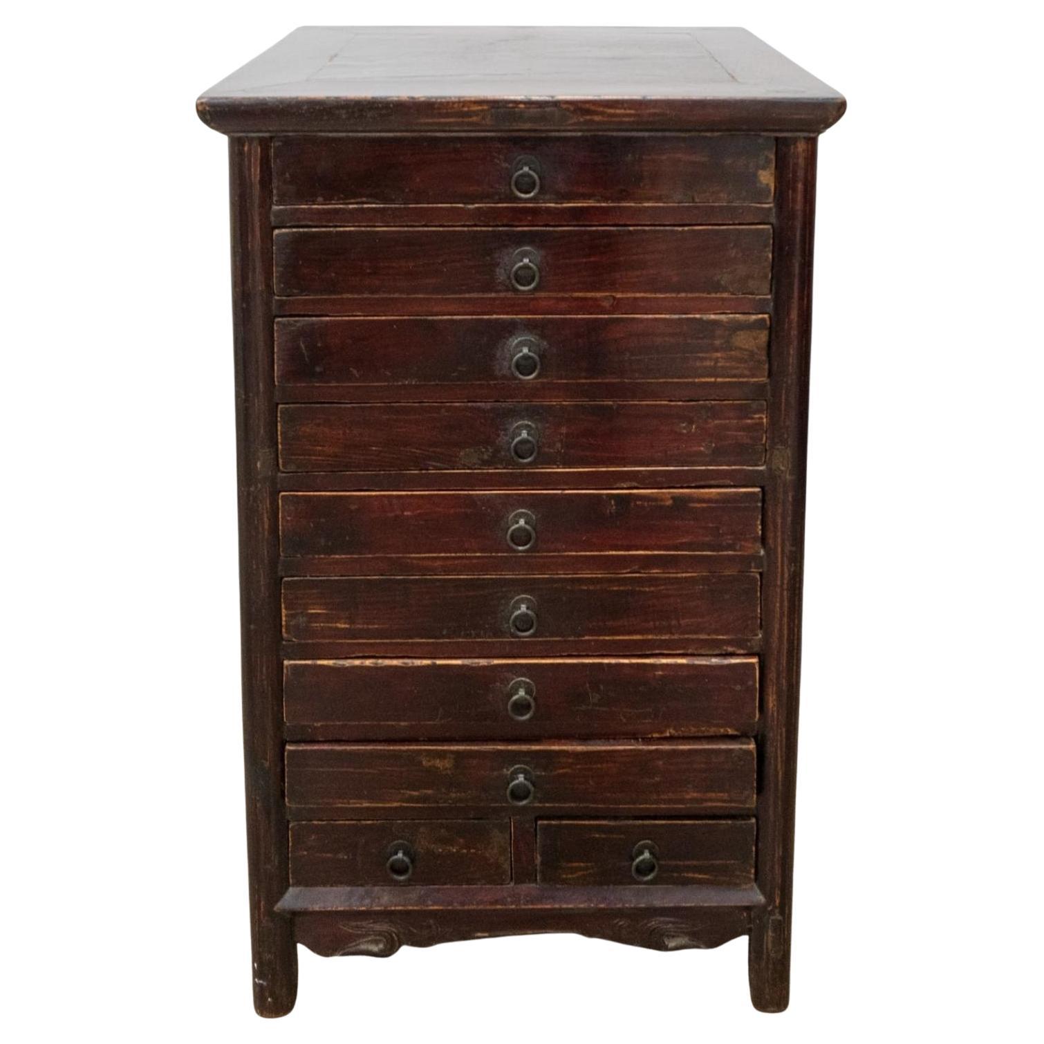 A Mid 19th Century Chinese Lacquered Elmwood Ten-Drawer Document Chest. Measures: 22.5