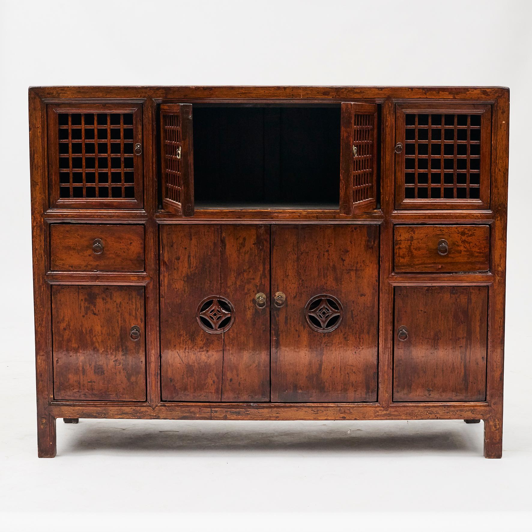 Lattice door cabinet from Shandong, China and dates to the late 1800s.
Original condition and lacquer with natural patina.
This type of cabinets was originally used to provide extra storage in the dining or sleeping areas of a home. China, circa