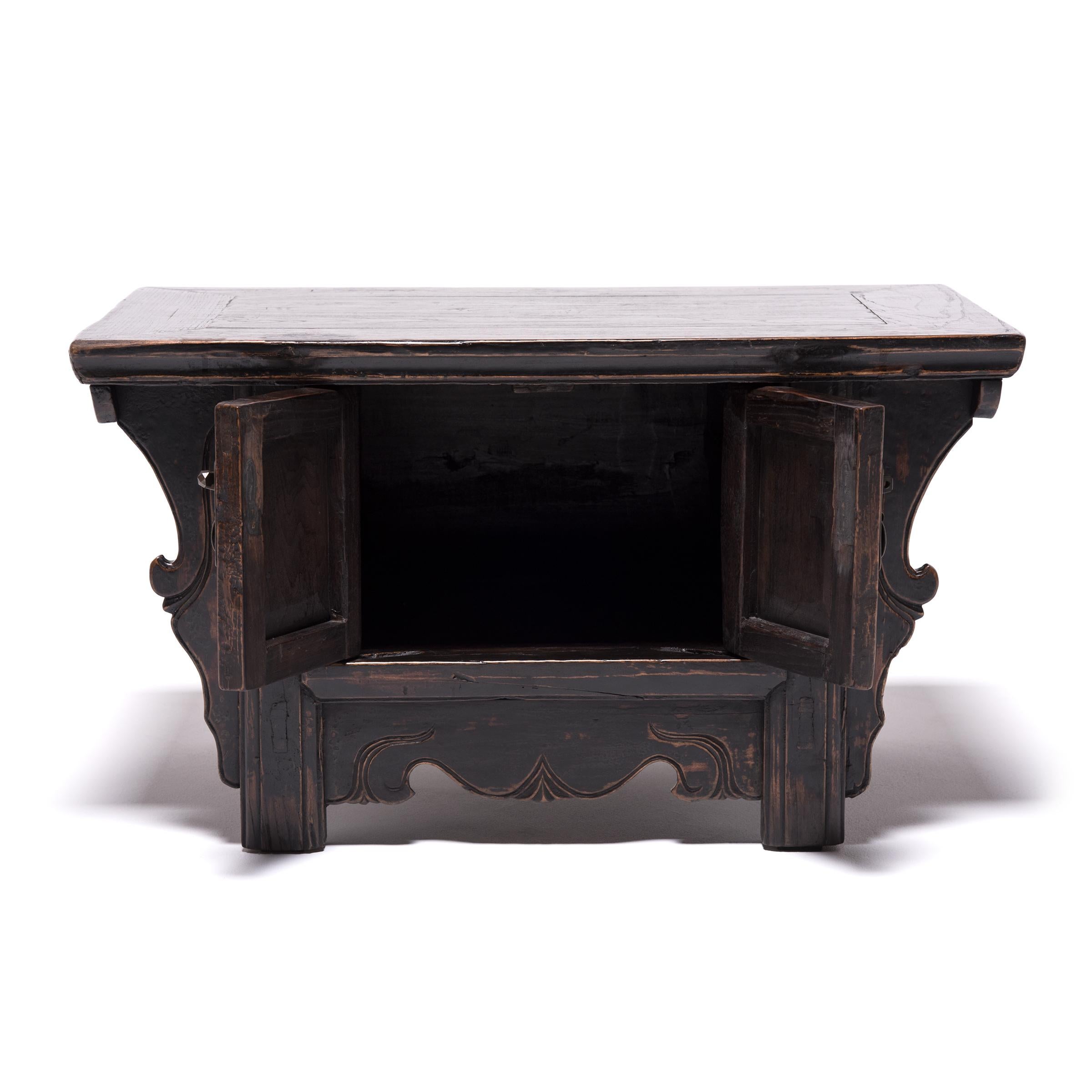 In a traditional northern Chinese home, a chest like this would have been placed beside a raised platform called a kang, which was used as a sleeping and living area. The cabinet would have kept essential items close at hand in intimate spaces. The