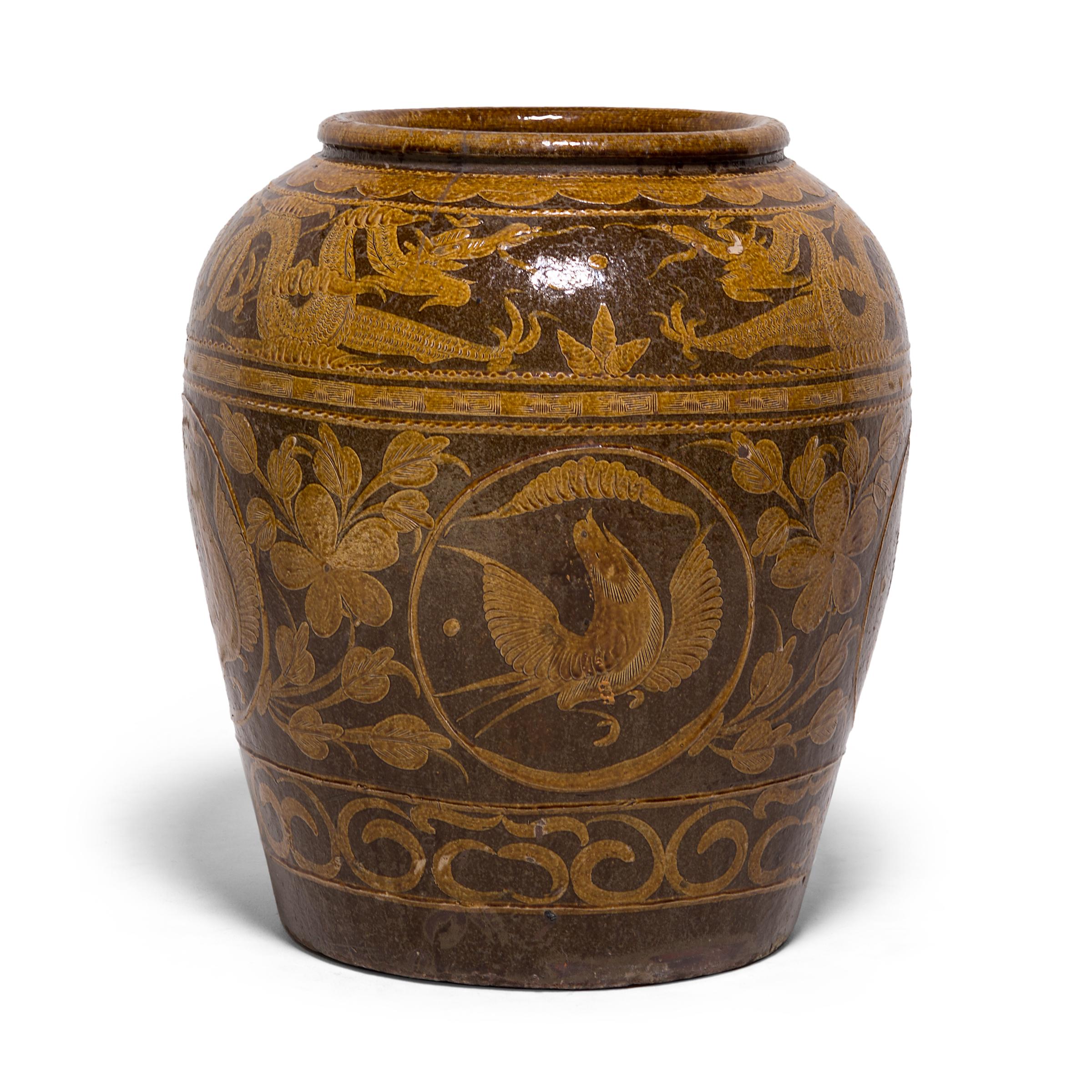 Unlike ceramics decorated with underglazing, this monumental vessel was painted after it was fired. This technique enabled the artist to build up areas and experiment with texture, visible in the stamped pattern along the painted bands and in the