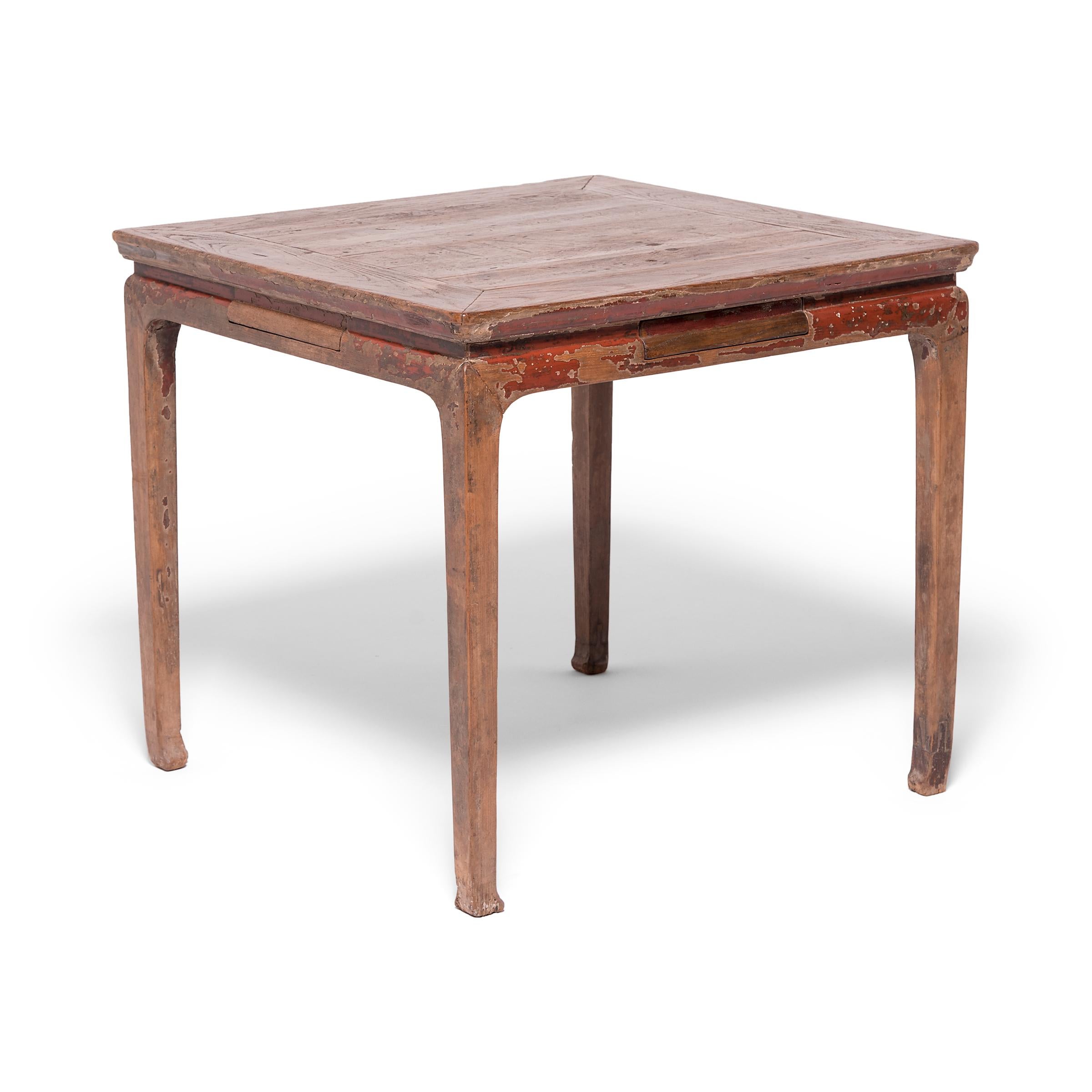 With straight legs and a square profile, this simple game table was once used for round upon round of mahjong, a popular Chinese game invented during the Qing dynasty. Constructed with traditional mortise-and-tenon joinery techniques, the card table