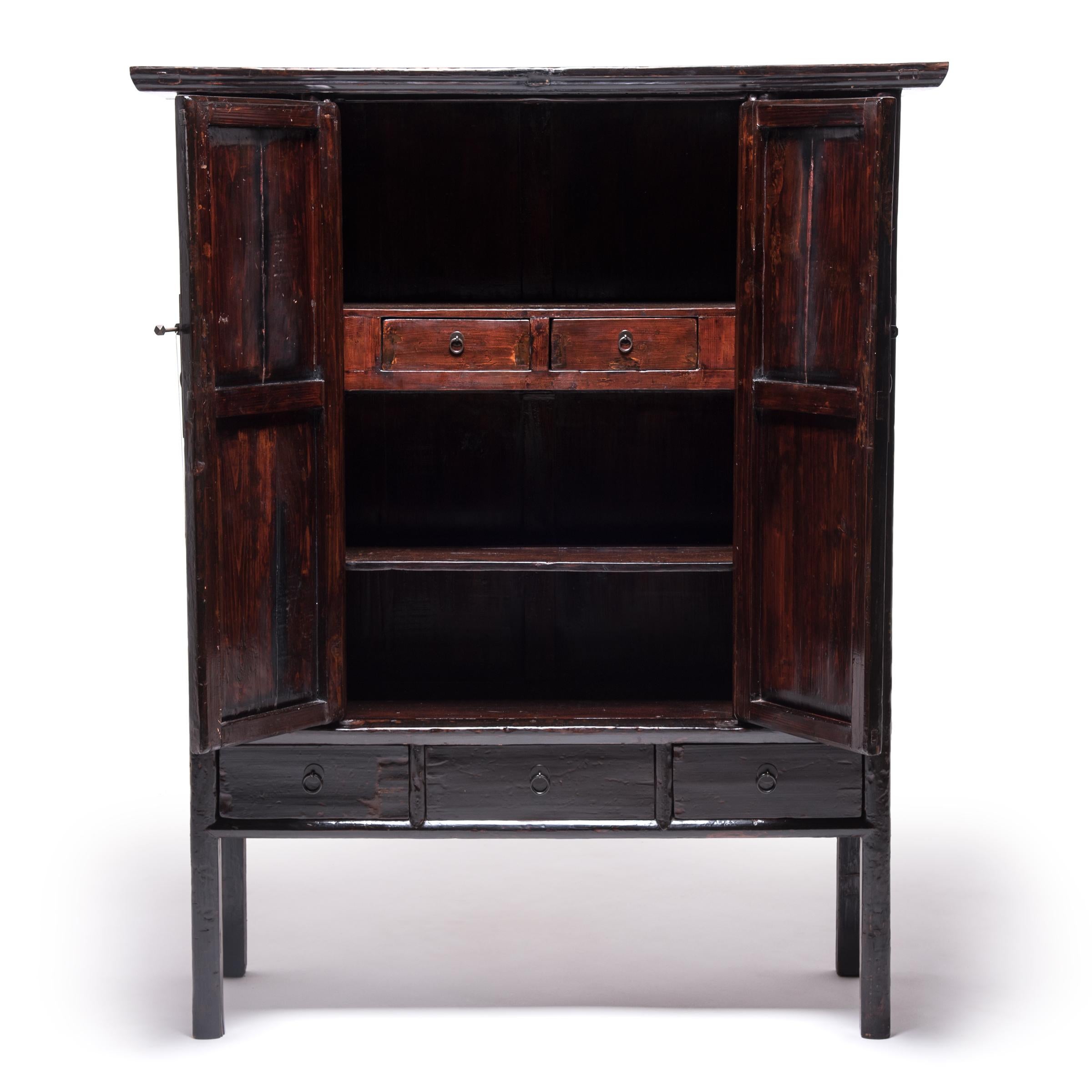 This painted cabinet beautifully represents 19th century Furniture from China's Fujian province. The simple, elegant form hearkens back to classical Chinese furniture designs, but the abstract painting and carvings were shaped by the artist’s