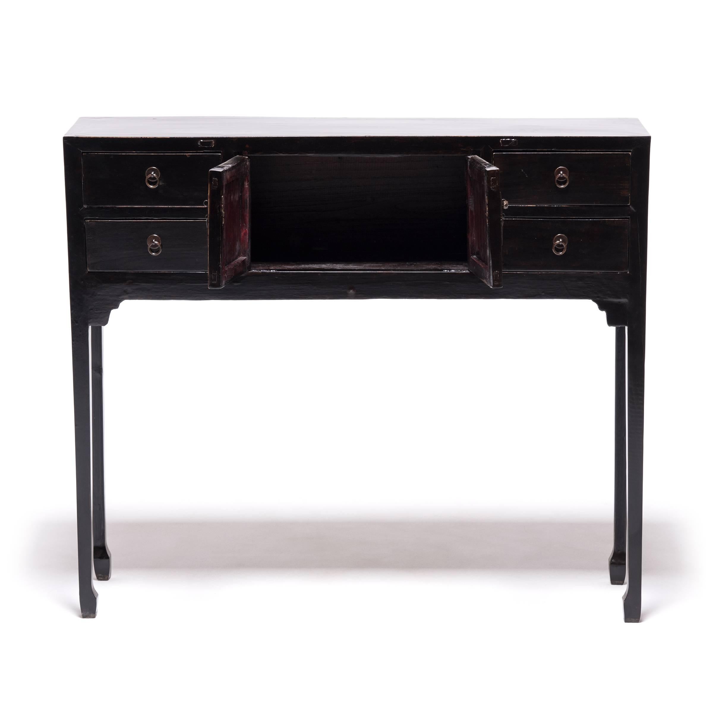 This 19th century altar coffer features clean lines in the Ming manner. It would have originally been used as storage next to a kang platform in a woman's sleeping quarters. Our carpenters, skilled in traditional methods, elongated the legs to make