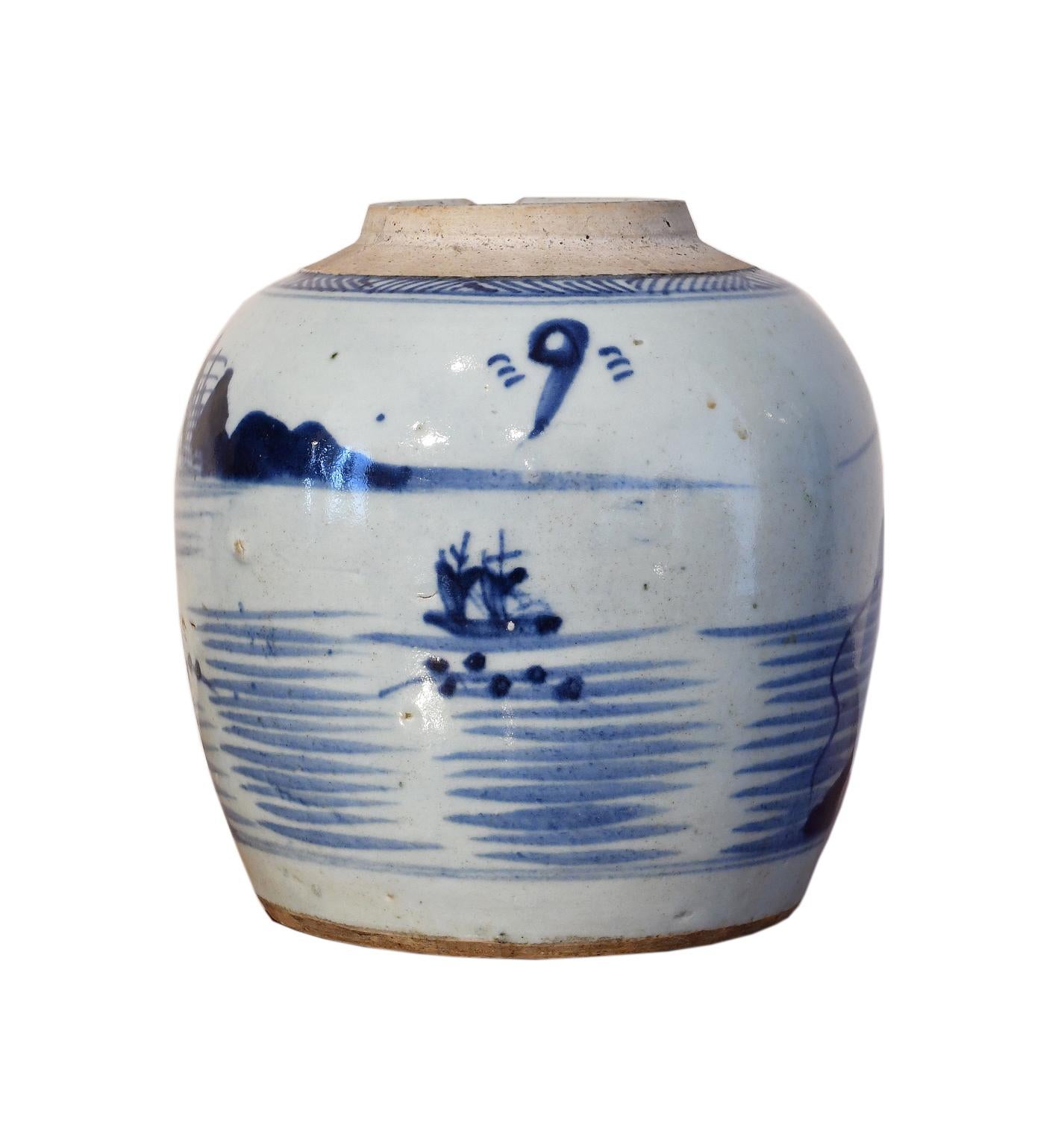 A charming Chinese porcelain jar with hand-painted landscape and river scenes in cobalt blue depicting a pagoda-like lighthouse in the foreground, and possibly the Yangshuo Mountains in the distance. Another scene shows a double-masted sailboat