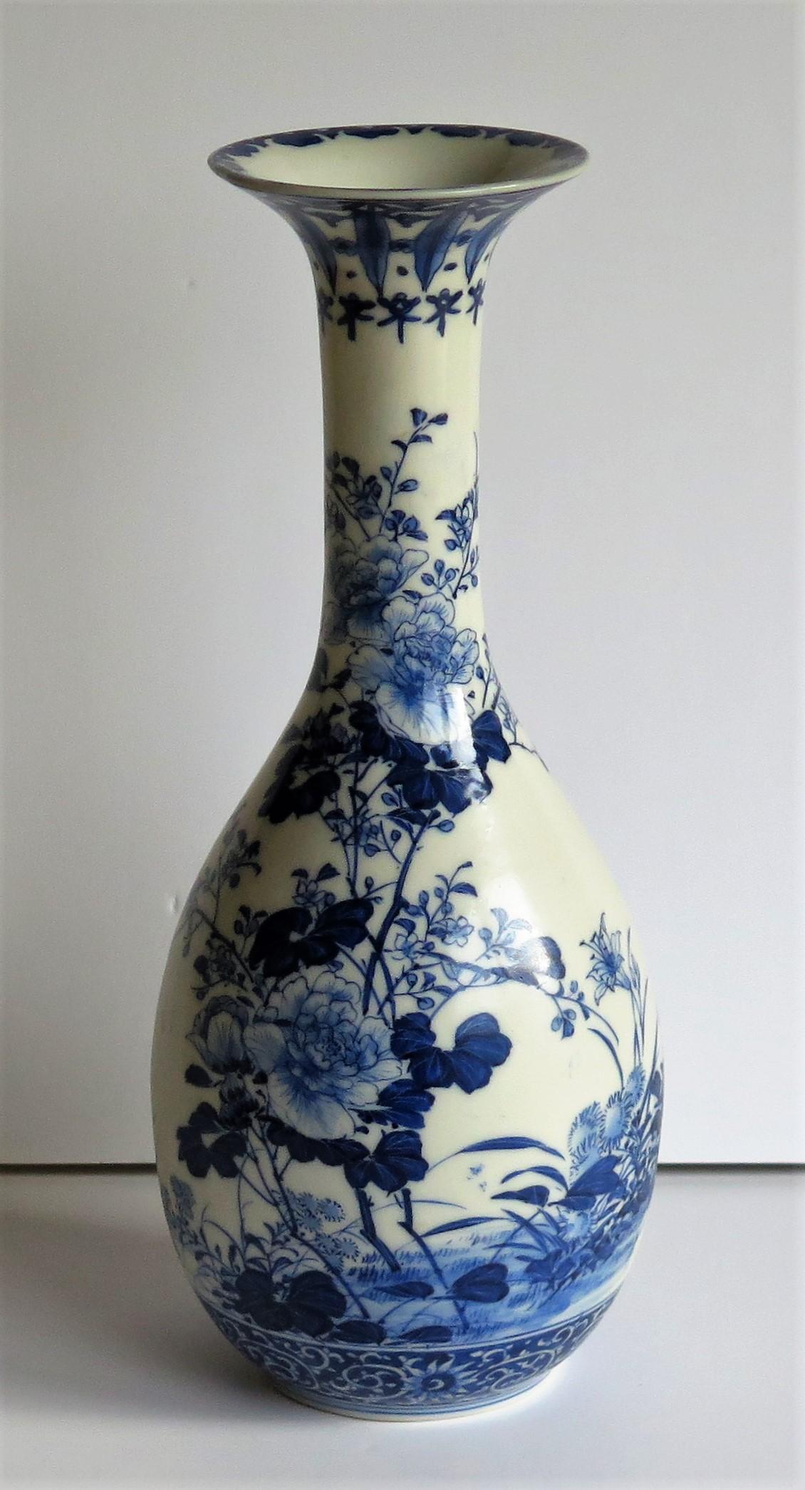This is a fine quality Chinese porcelain blue and white bottle vase which we date to the mid-19th century, Qing Dynasty, circa 1850 or possibly earlier.

The vase is well potted and has a bottle pear-shaped body supported on a low foot and with a