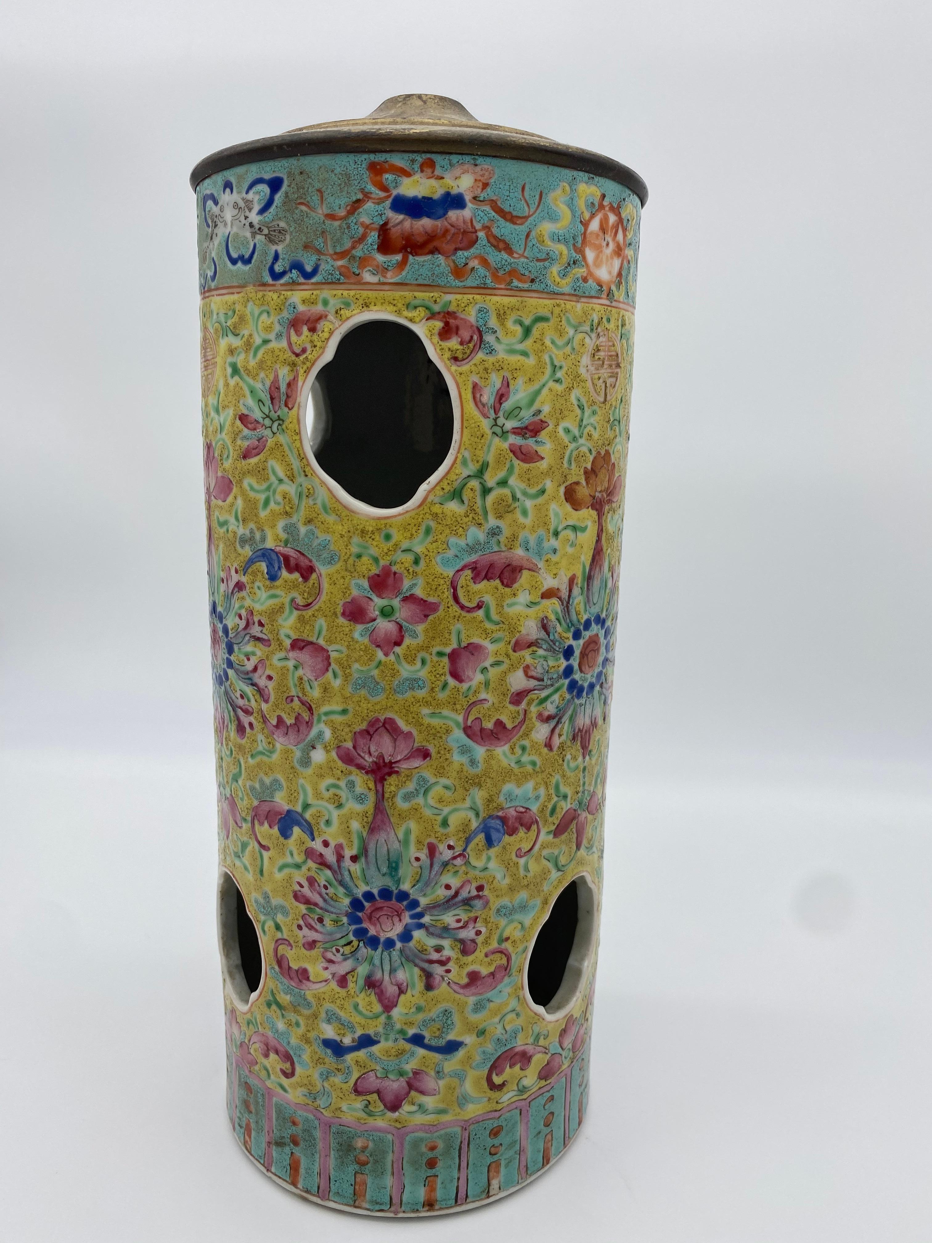 19th century antique Chinese porcelain hat stand. Derived from the period of the Qing Dynasty. Decorated in golden yellow background with red and blue flowers. Hole on the bottom can be used to convert hat stand into lamp.