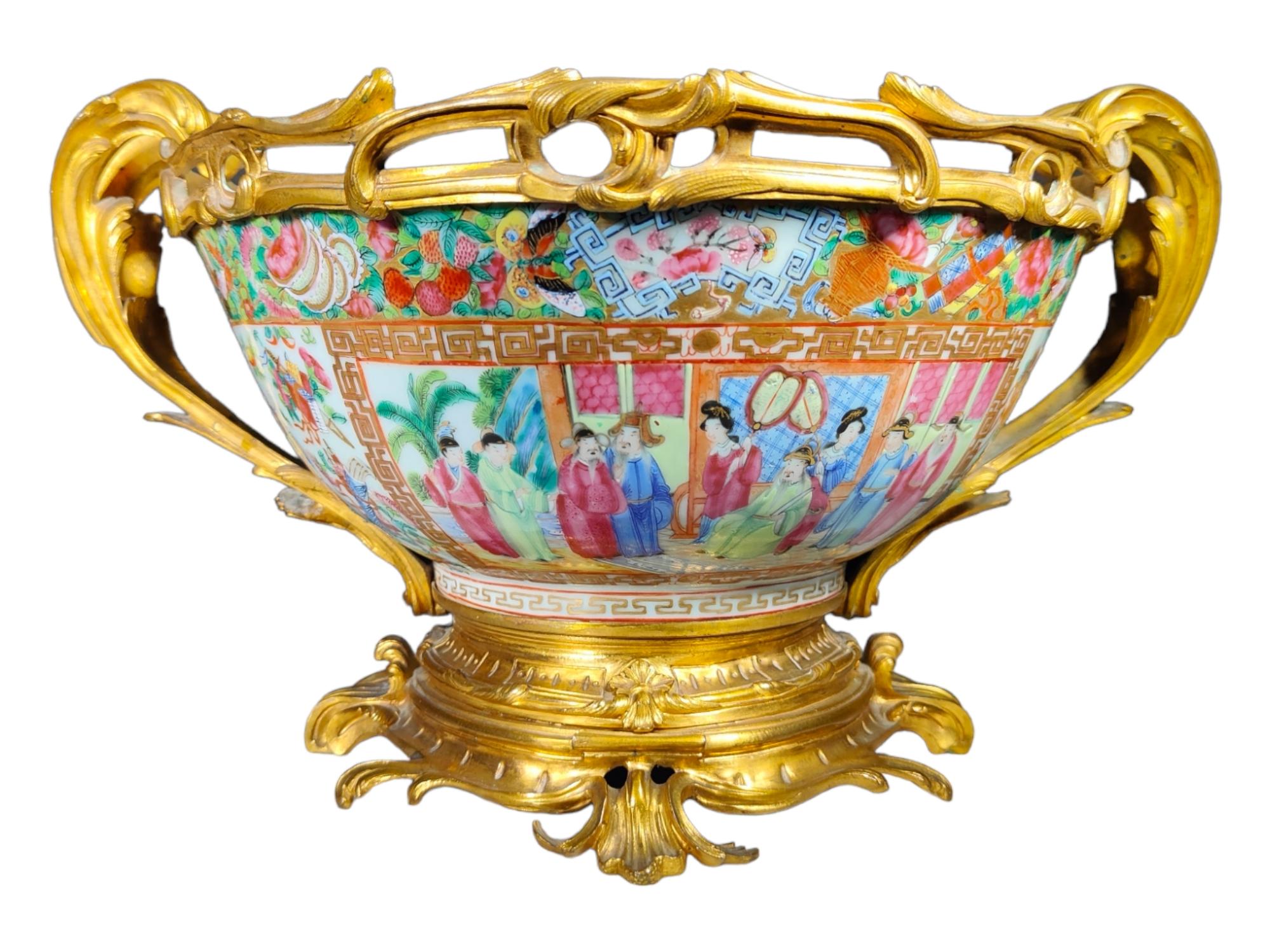 19th Century Chinese Rose Medallion Ormolu Mounted Centerpiece Bowl
CHINESE ROSE MEDALLION PUNCH BOWL WITH FRENCH GILT-BRONZE MOUNTS, PORCELAIN XIX TH, gilded bronze mounts, the large circular bowl gaily decorated with figures at leisure in a