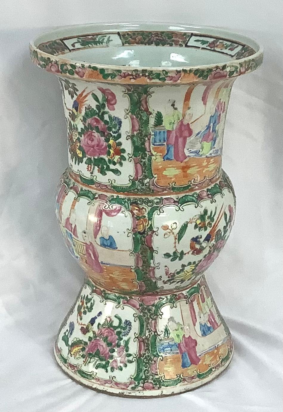 Antique 19th century rose medallion vase with a bulbous center section and a smaller flared out section on the bottom and a larger flared out section on the top The colors are vivid. The decoration is superb.