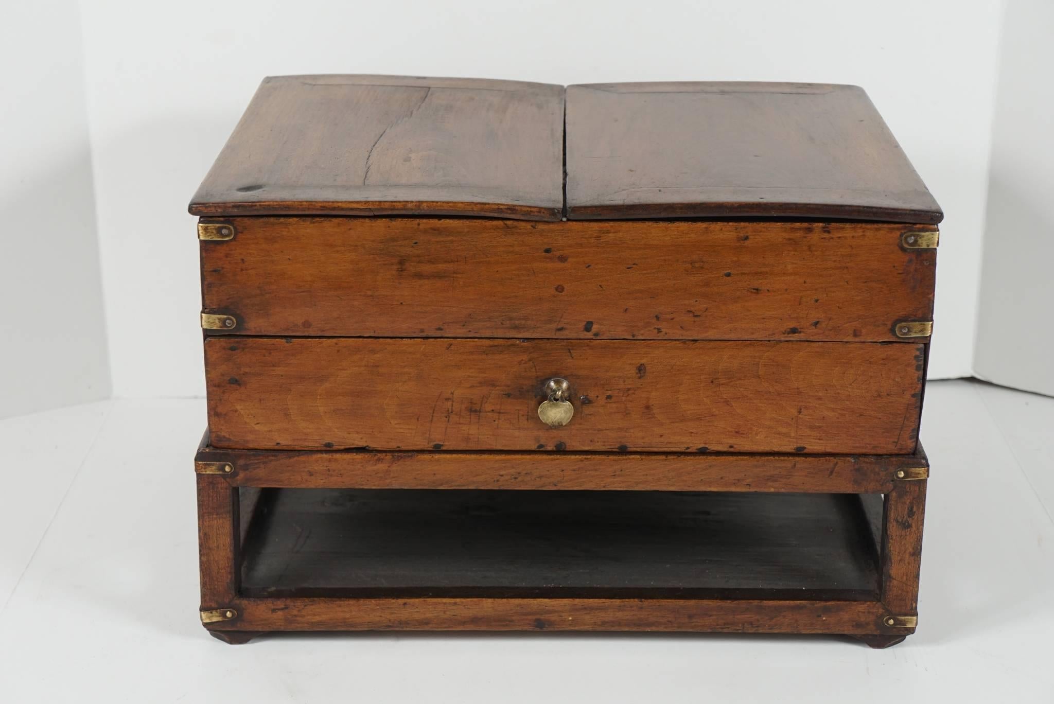 This box built on a raised openwork stand is a lovely old example of Chinese provincial furniture construction. Made circa 1880 the piece shows long years of use and love with a very nice old surface and patina. The top has two lids that remove and