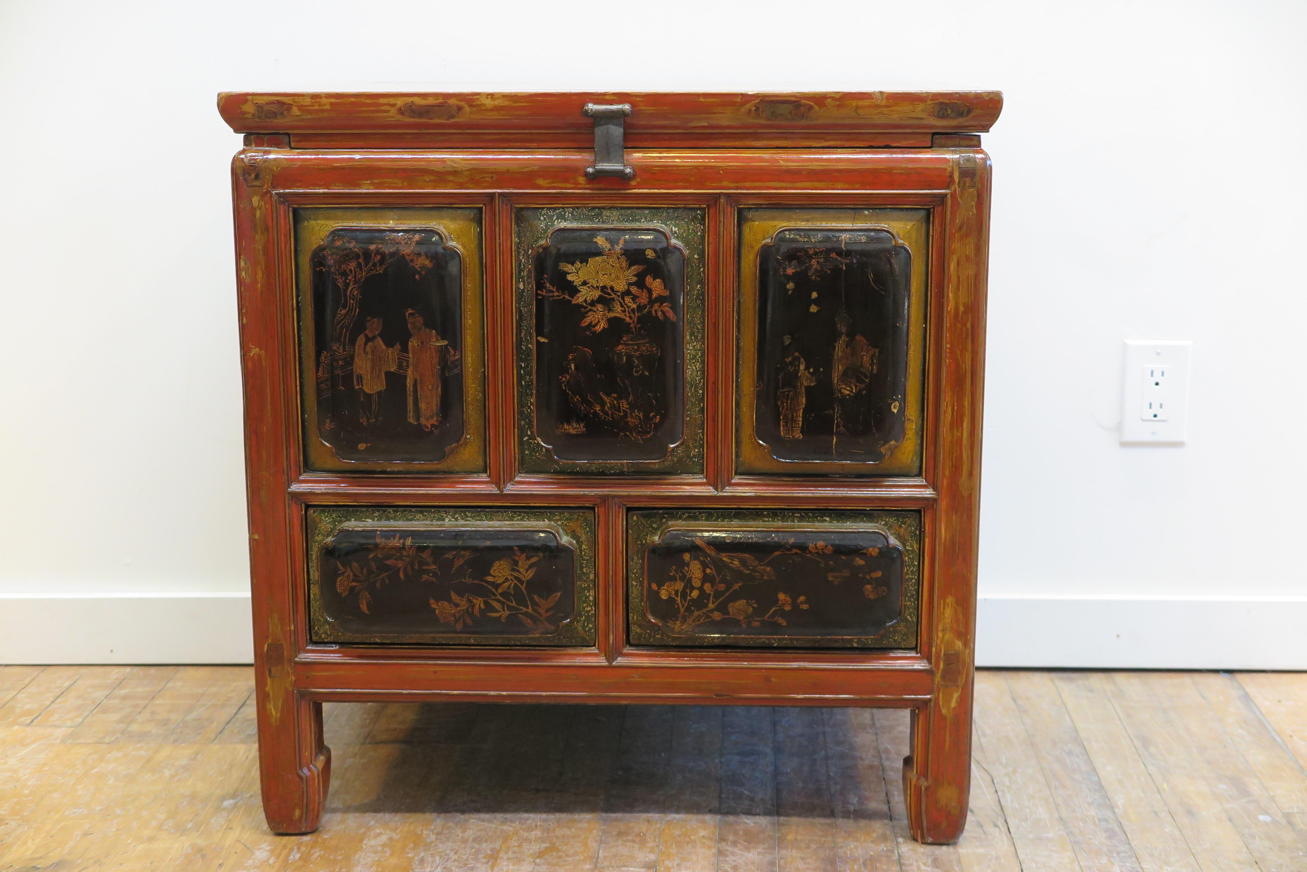 Oing Dynasty Antique Carved Raised Panel Cabinet painted top chest.  Beautiful hand painted lacquered Cabinet Chest from Fujian province China. 
Two drawers with top open cabinet.  Detail carved raised panels front and sides.  Very good antique