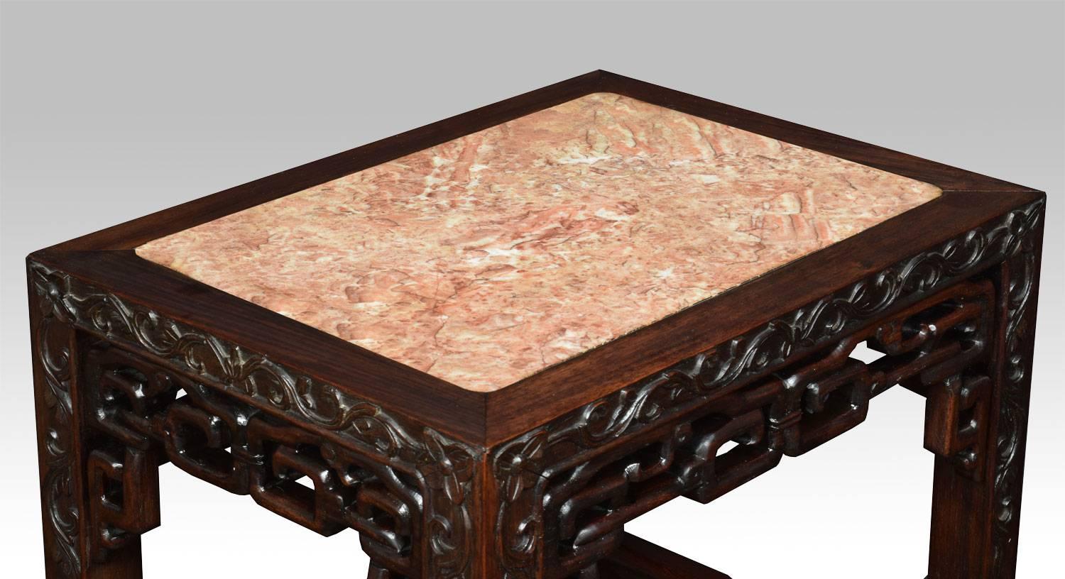 Chinese hardwood stand, the rectangular marble top above pierced foliating carved freeze, raised up on four claw supports united by under tier.

Dimensions:

Height 32 inches.

Width 16 inches.

Depth 12 inches.


