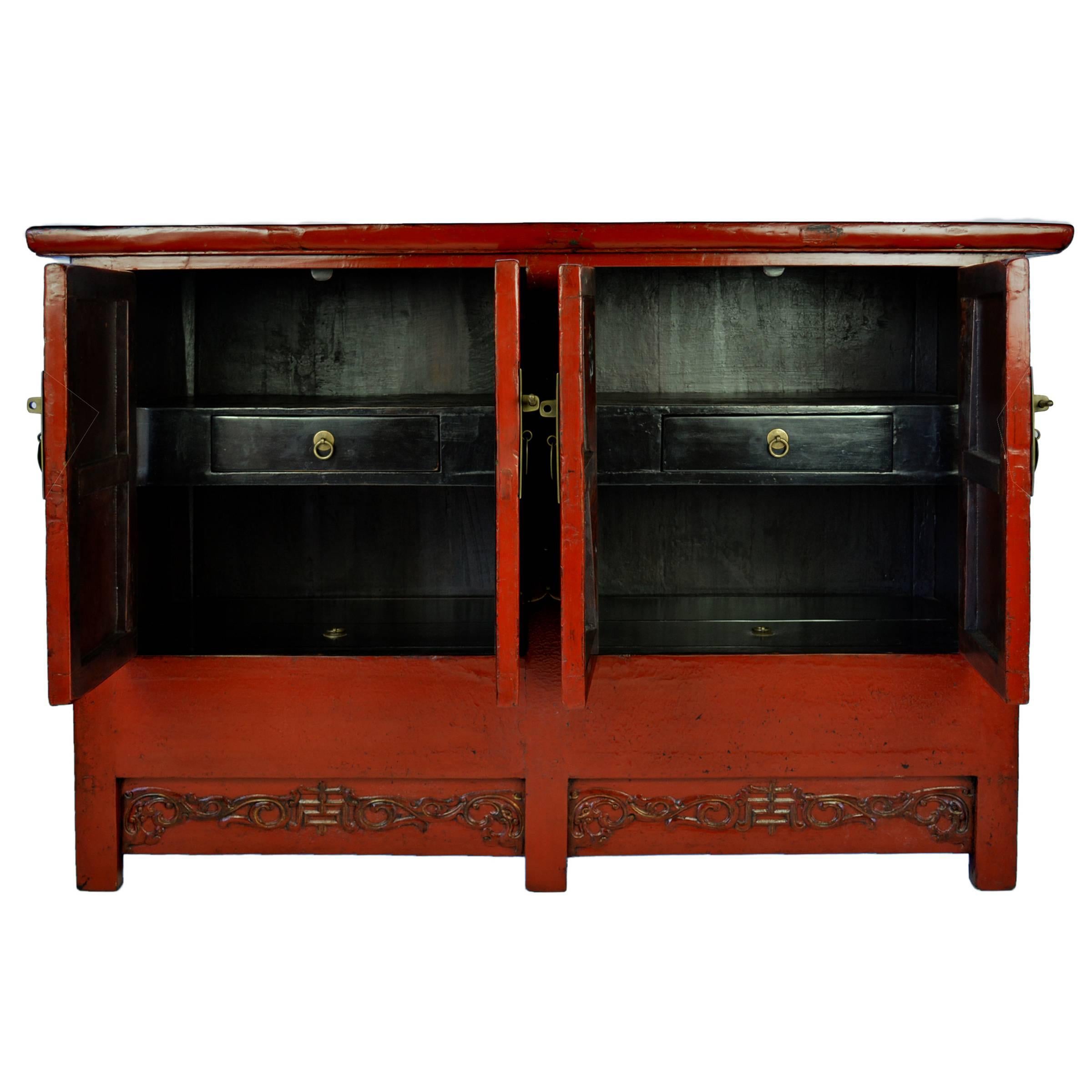 Since traditional 19th century Chinese homes were built without closets, this red lacquer chest would have been used for general storage. The centre of each apron is carved with the symbol for longevity amidst trailing vines. The red lacquer finish