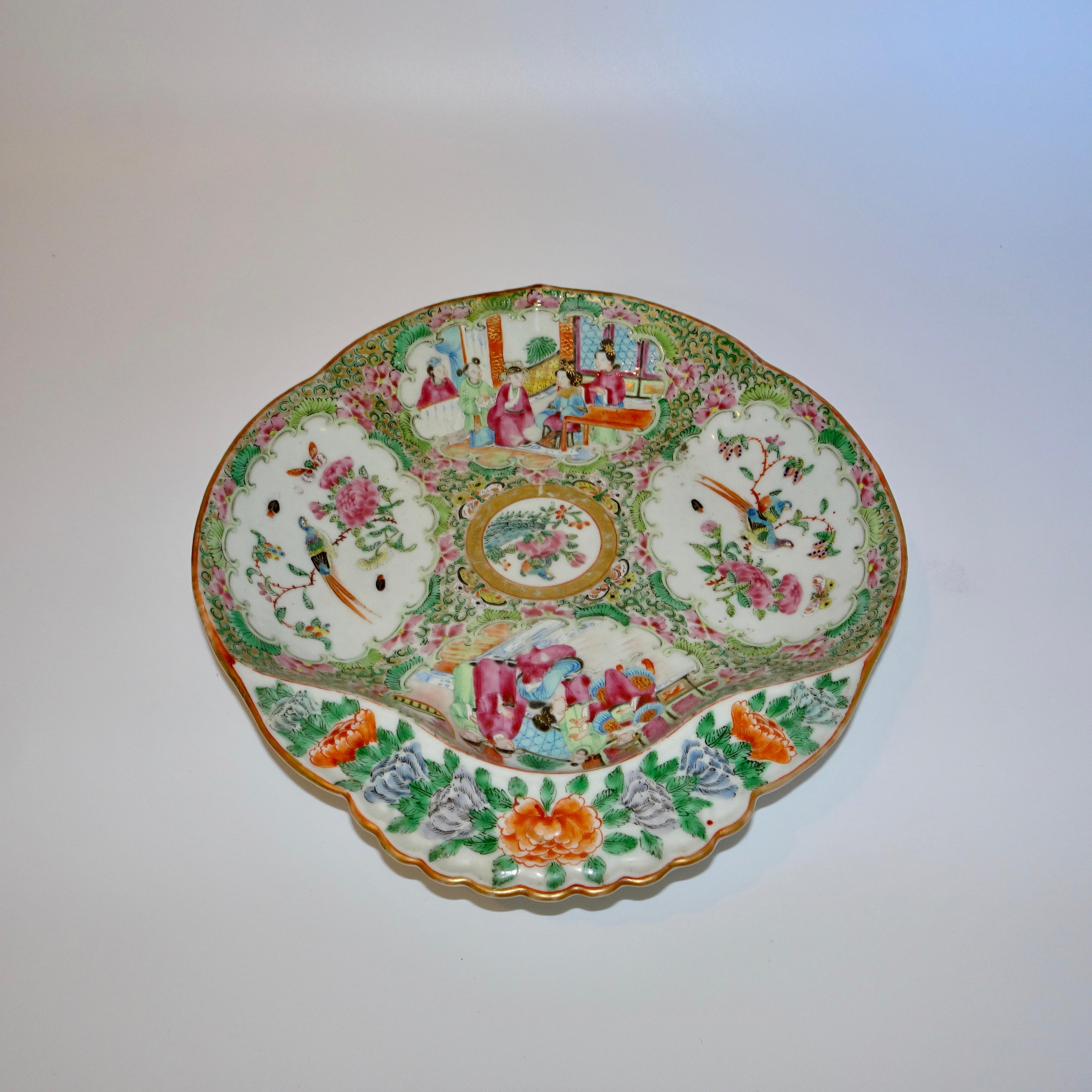 This 19th century Chinese rose medallion porcelain dish can also be called a shrimp plate. The dish is in the traditional rose medallion colors of green, pink, orange and blue.