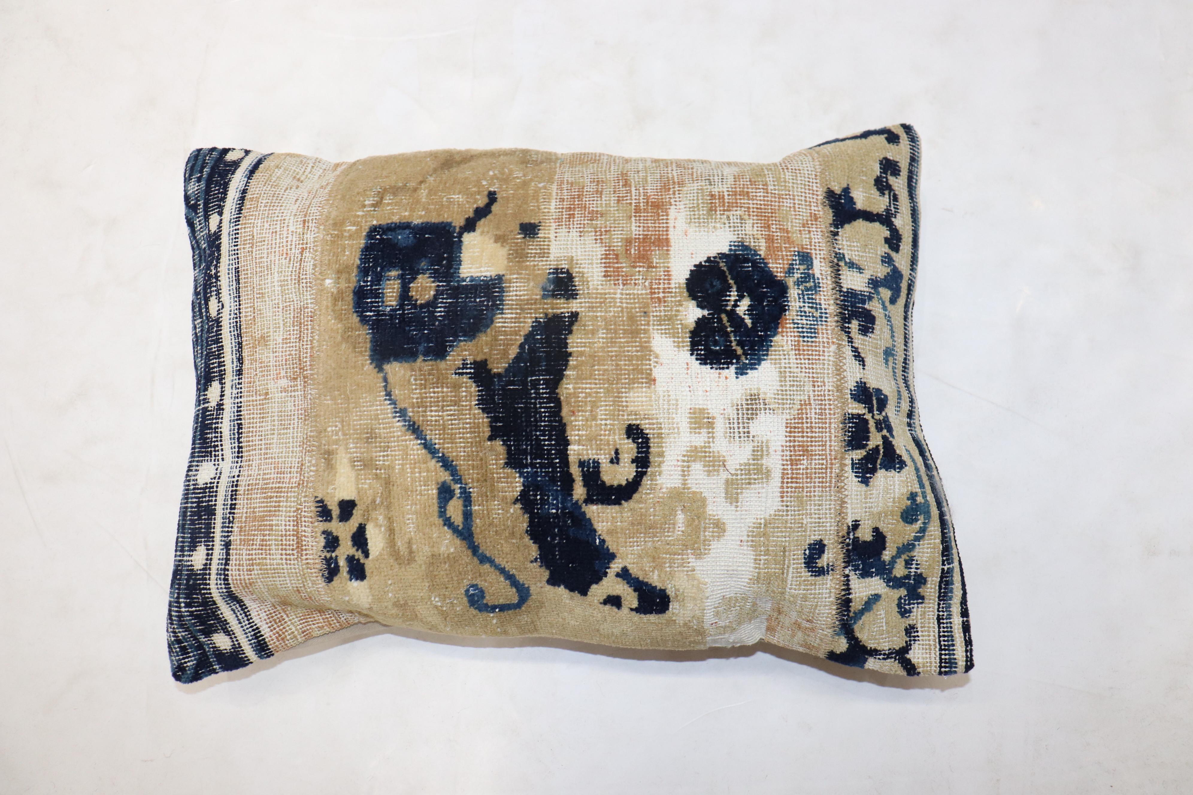 A pillow made from a 19th-century Chinese rug. Zipper closure and insert included.

Measures: 15” x 22''.