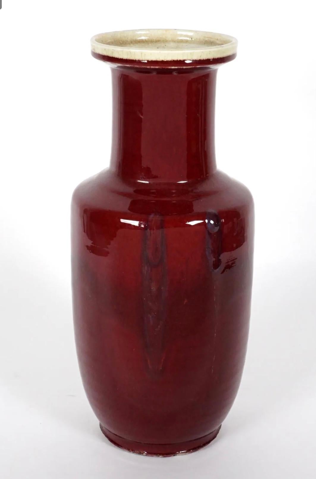 A large 19th Century Chinese Sang de Boeuf vase of baluster form.

The name ‘sang de boeuf’ refers to the color of the vase, which is French for ‘ox blood’. The difficult manufacturing process of this shade, which is achieved through an