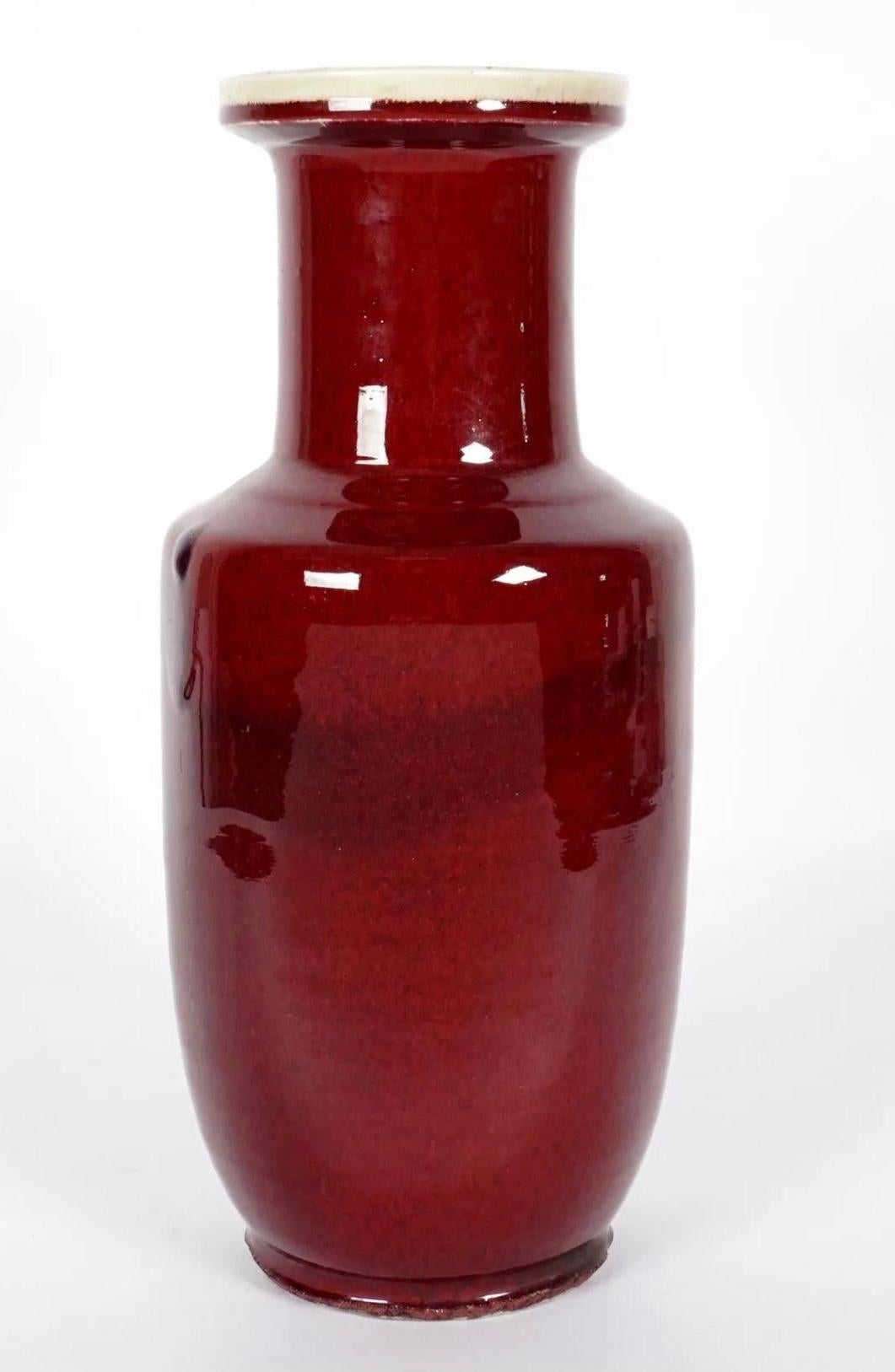 A large 19th Century Chinese Sang de Boeuf vase of baluster form.

The name ‘sang de boeuf’ refers to the color of the vase, which is French for ‘ox blood’. The difficult manufacturing process of this shade, which is achieved through an