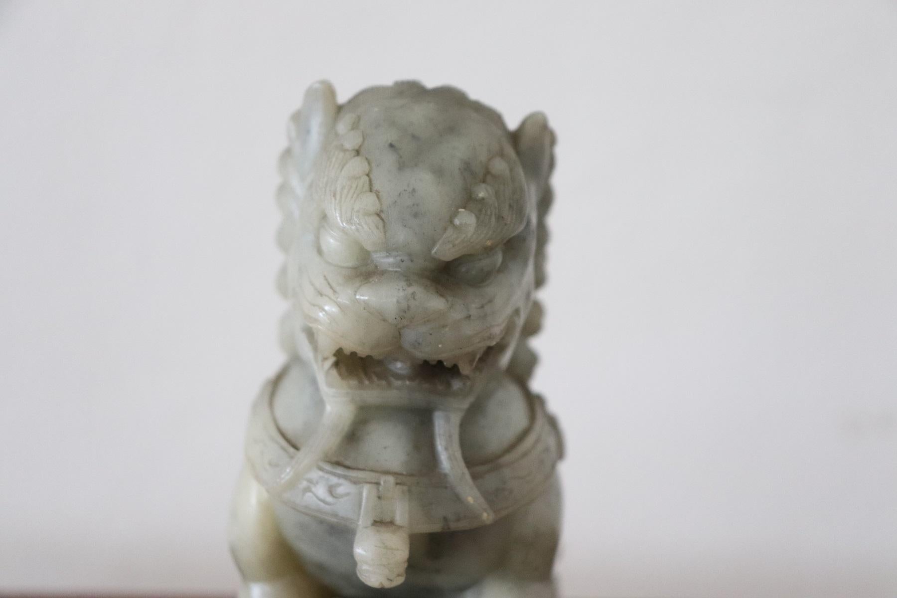 Beautiful antique sculpture in precious green jade made in china. Fine figure of Lion in Chinese symbolic culture they are guardians of the temple.