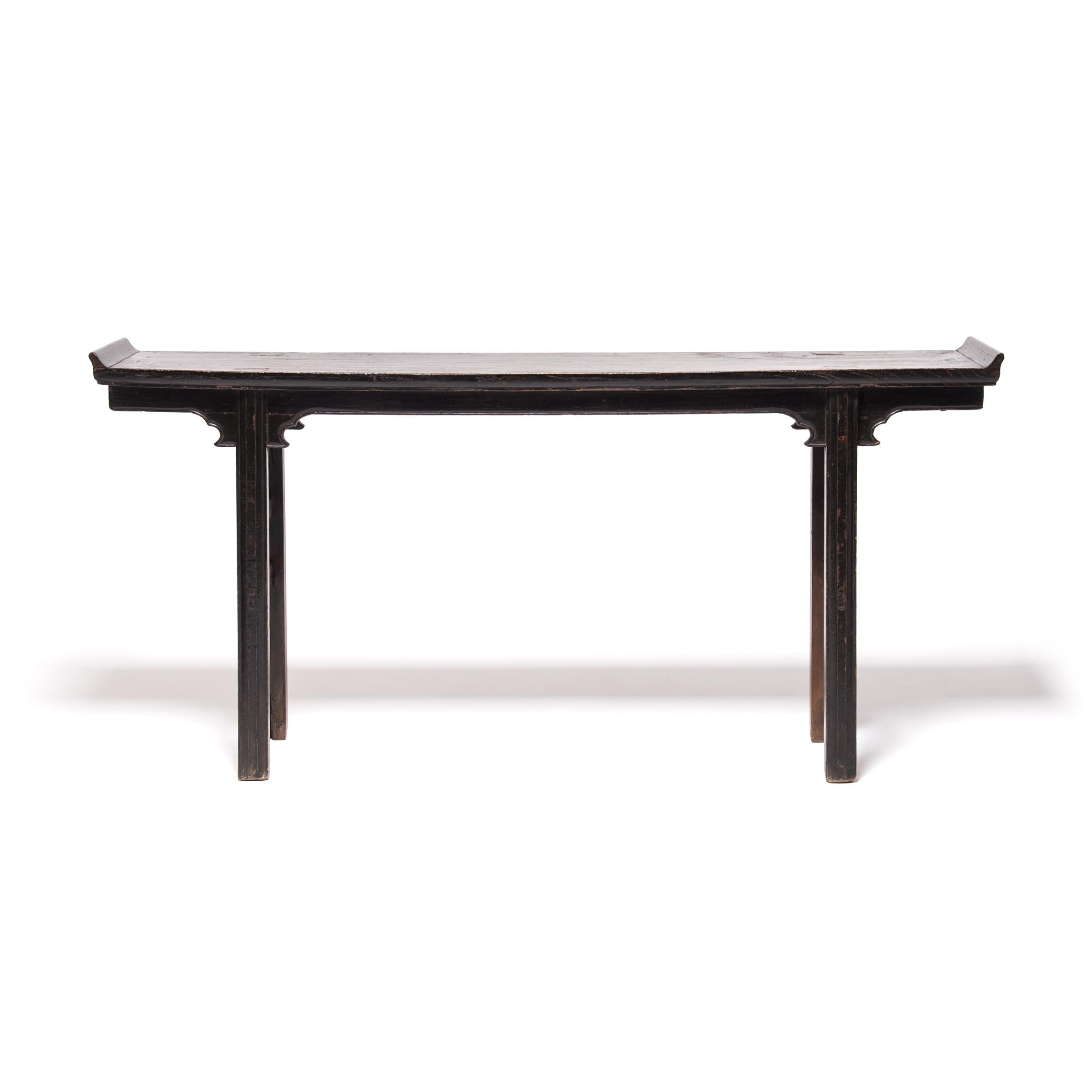 A century and a half ago this elm wood table probably sat in the home of a Qing-dynasty family, used as their ancestral altar. The clean lines would have complimented the Classic Chinese architecture of the home, but the elegant simplicity makes