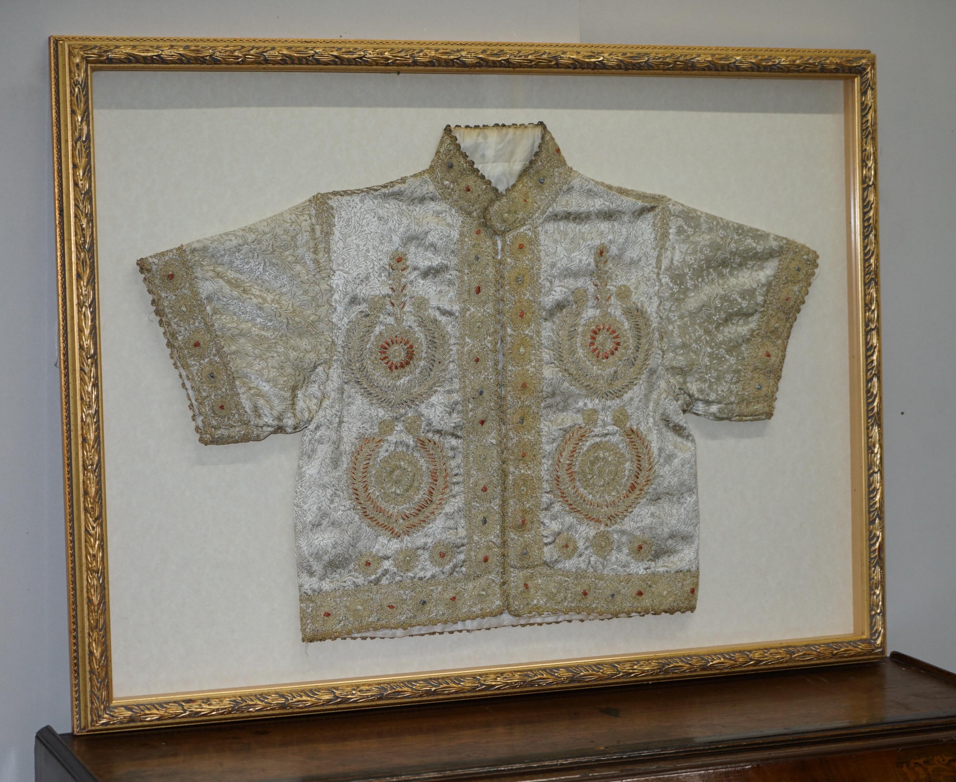 We are delighted to offer this very rare 19th century Chinese silk embroidered ceremonial robe in a lovely glass picture frame display case

An extremely decorative piece, the quality and craftsmanship is second to none. This piece was clearly