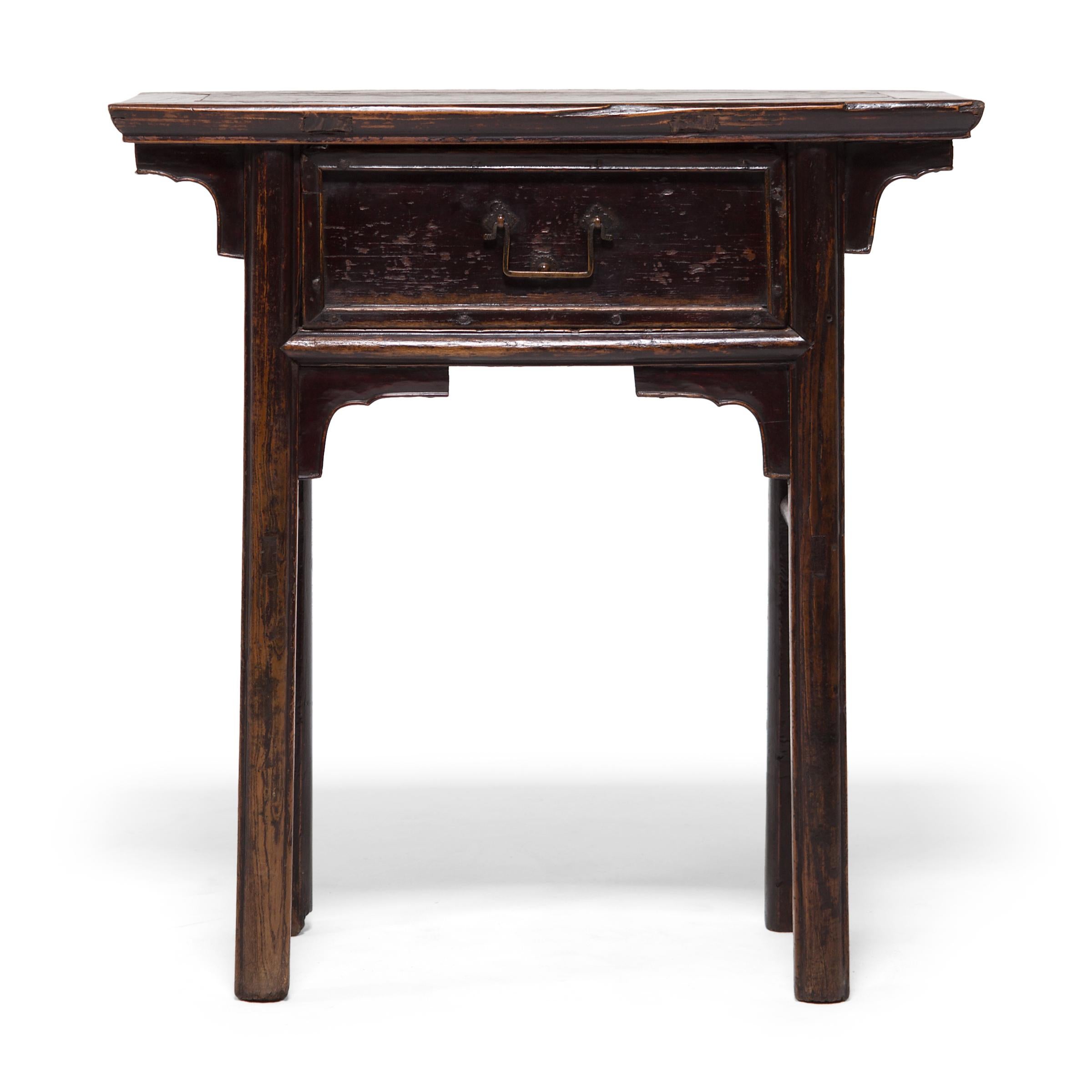 This clean-lined elmwood table from China's Shanxi province was likely used as an altar table in a Qing-dynasty home. Designed to display incense and offerings, the narrow table has a single drawer intended for storing incense and other accessories.
