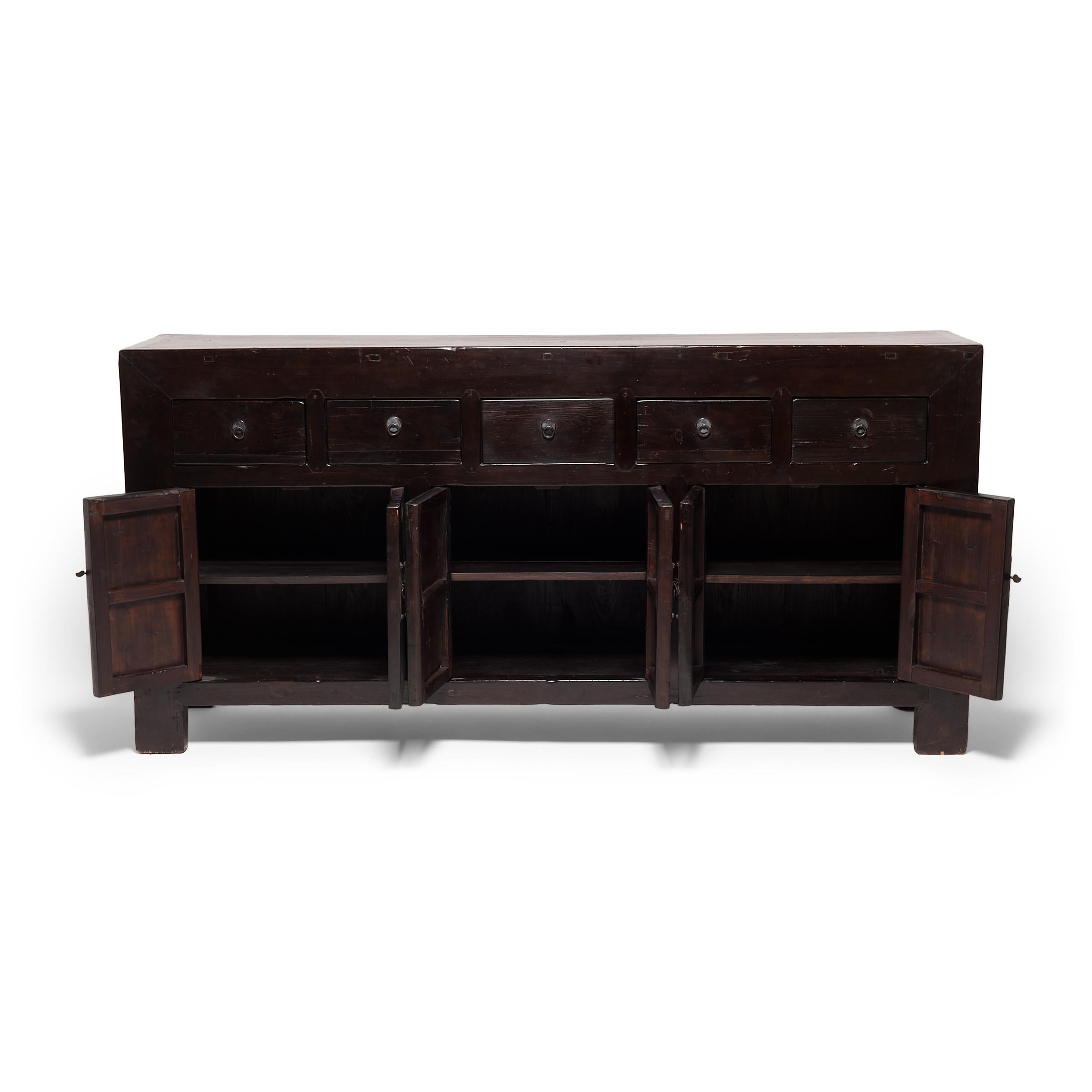 A skilled artisan of China's Shanxi province built this storage coffer, respecting the refined lines of Ming-dynasty furniture design by using traditional mortise and tenon joinery techniques. Its beautifully-worn finish shows years of use by the