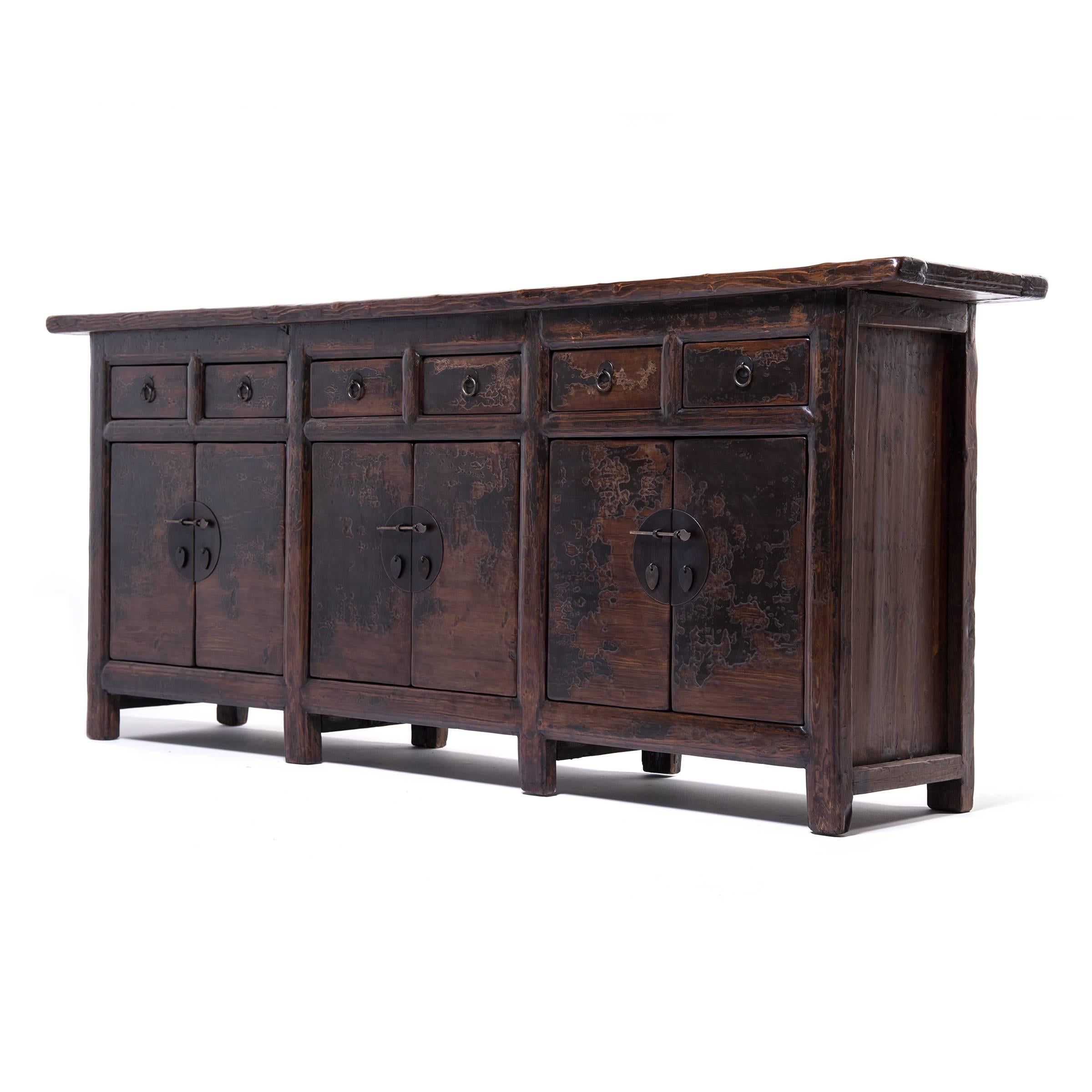 This monumental coffer was made in China’s Shanxi province and is emblematic of 19th century Chinese furniture design with its thoughtful proportions, select timbers, solid brass hardware, and masterful mortise and Tenon joinery. The flush panel
