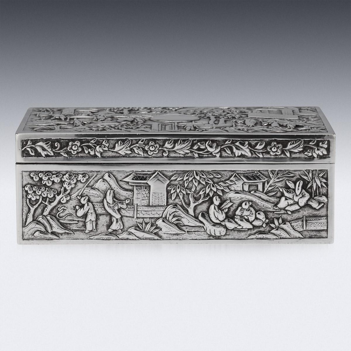 Antique 19th Century Chinese export solid silver box, of rectangular form, decorated in repousse' high relief, on very finely tooled matted ground, depicting various figures in a landscape, including dignitaries, attendants amongst palaces,