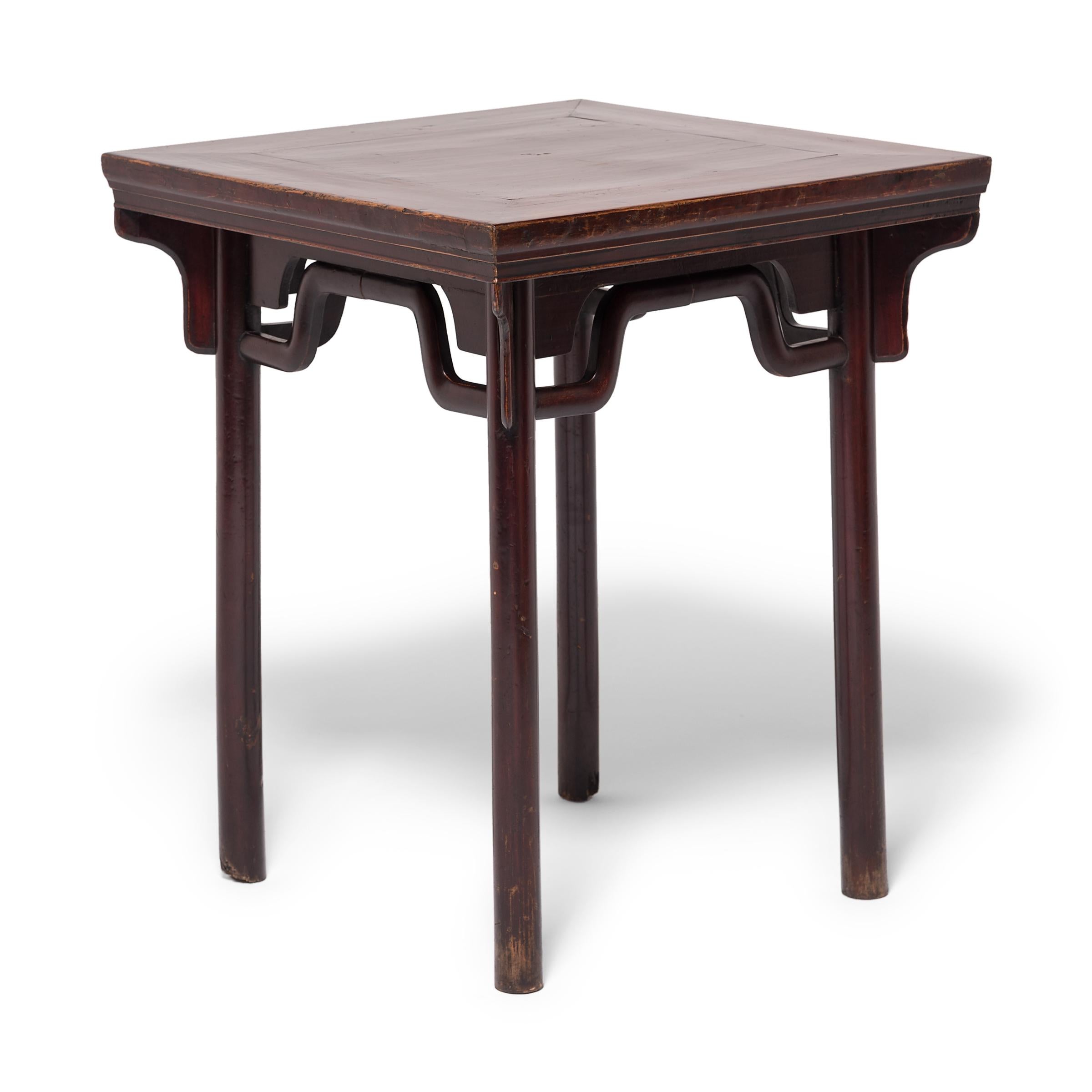 Though created in the Qing dynasty, this square table owes its elegant proportions to Classic Ming dynasty design principles. Ming table design was centered on a harmonious blend of straight and curved lines. This table's tall, slender legs