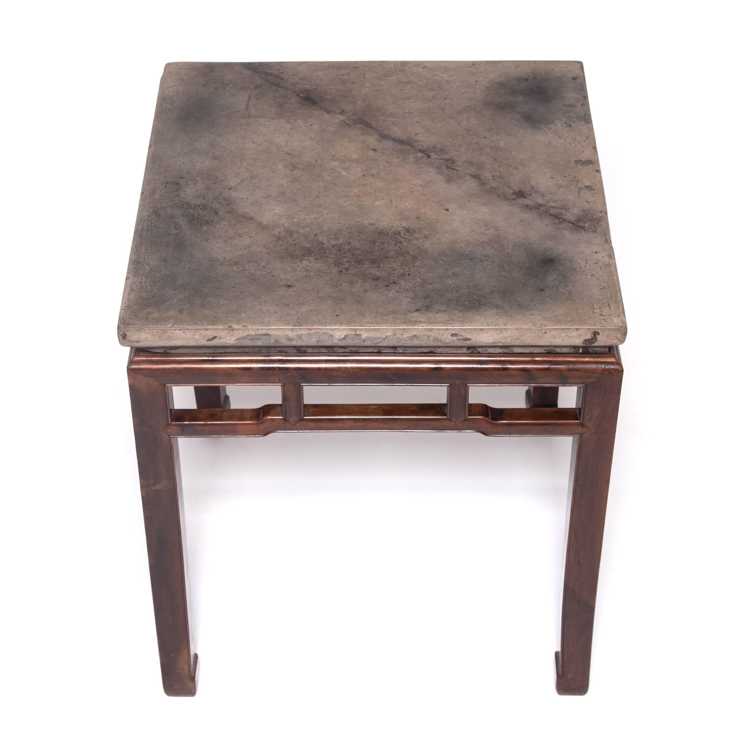 In our 20 years of collecting, we've never come across a late 18th-early 19th century stone top as distinctive as the one on this table. The undercut, decorative-edged stone has aged exquisitely over hundreds of years of use—it was likely used for