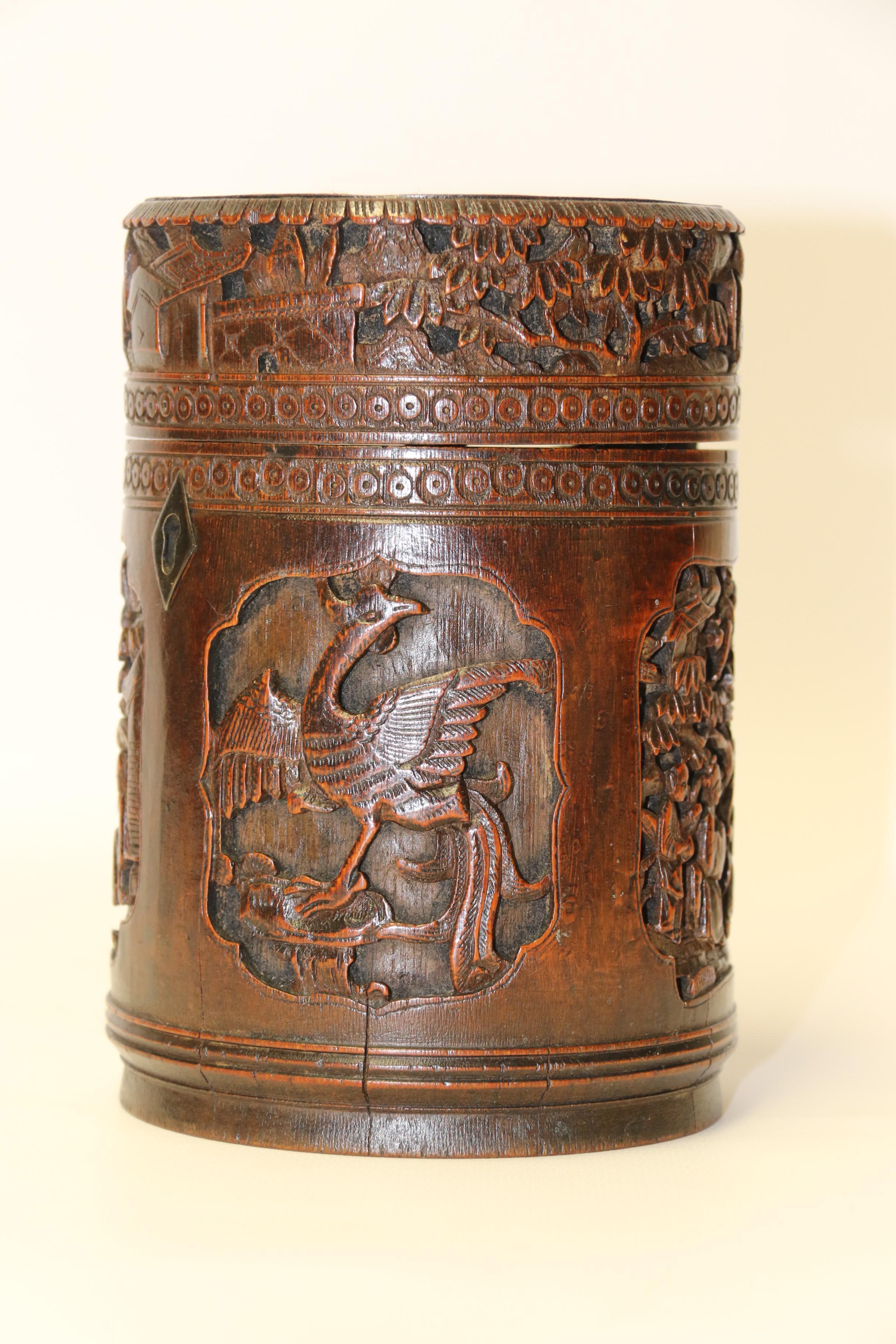 This interesting late 19th century tea caddy originates from Chinas Canton region where this type of workmanship was a specialty. It is made from a large trunk section of bamboo using the natural hollow to form the interior which is lead lined for