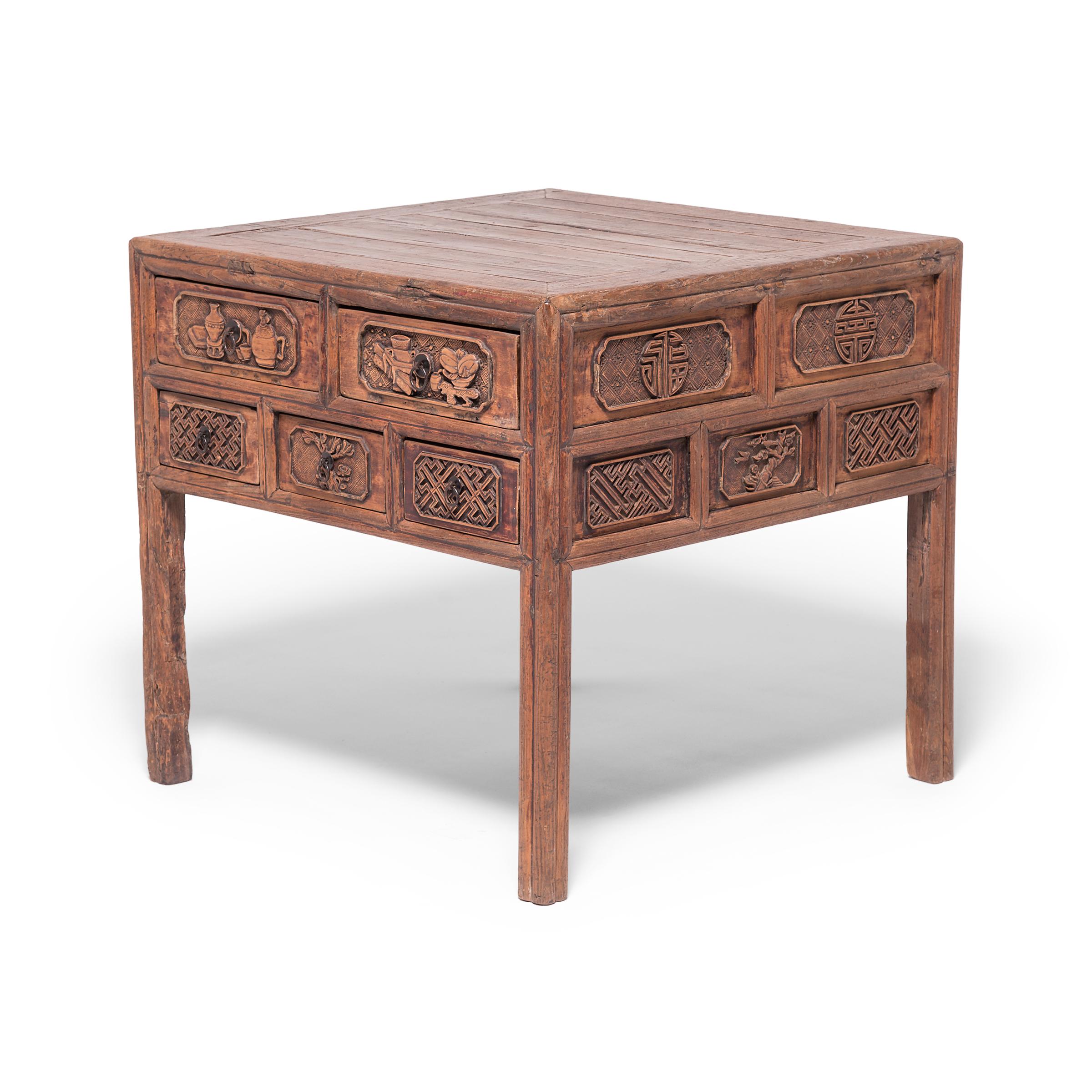 Appealing to the rarified taste of China’s literati, this Qing-dynasty table depicts the auspicious objects found in a scholar’s studio, including censors, scrolls, and fine porcelain. The table’s straightforward design puts all eyes on its ten