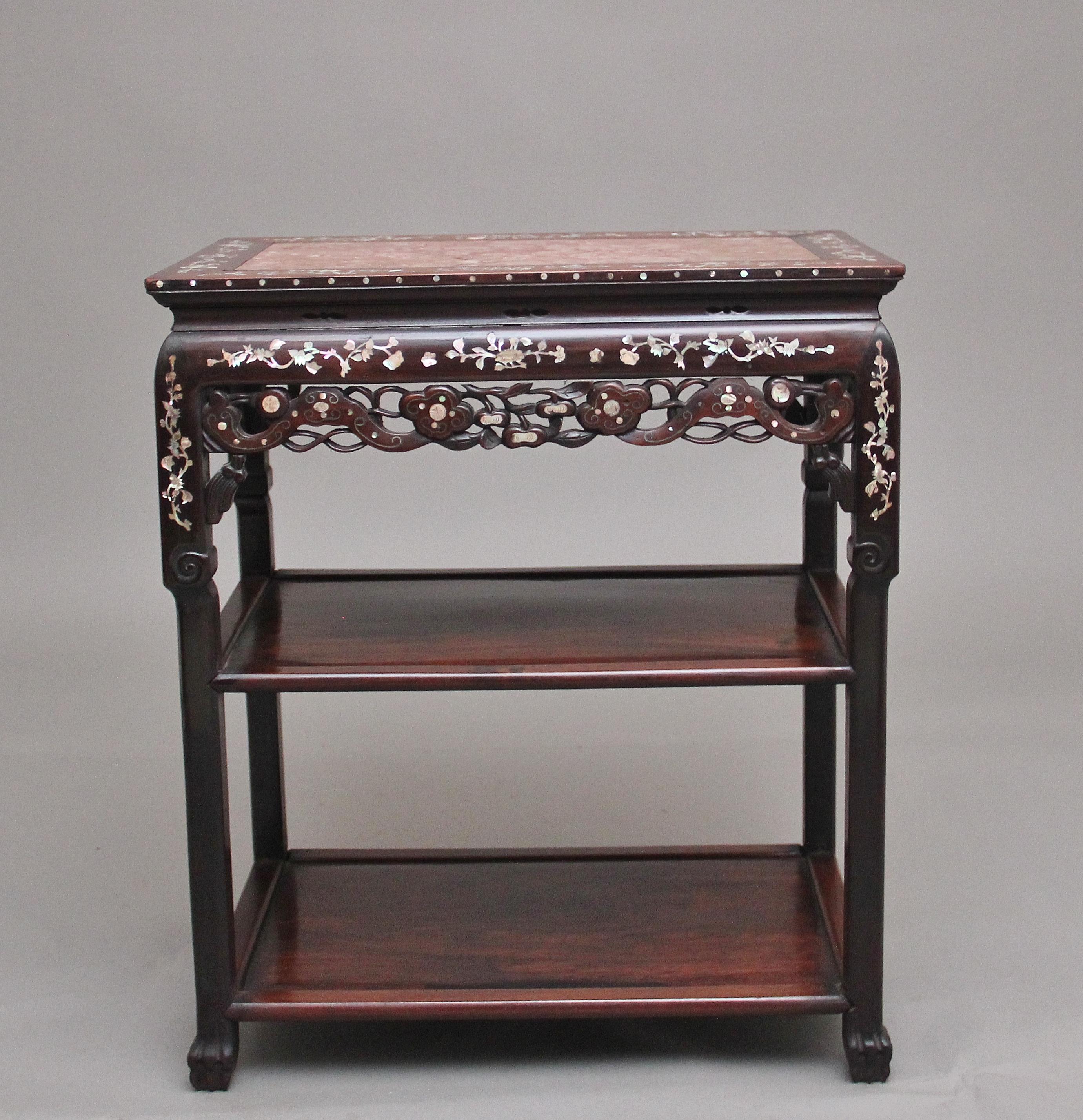 A lovely quality freestanding 19th century Chinese three tier occasional table, the rectangular top inset with a rouge marble panel, the hardwood border of the top profusely inlaid with mother of pearl floral patterns, there is also further mother