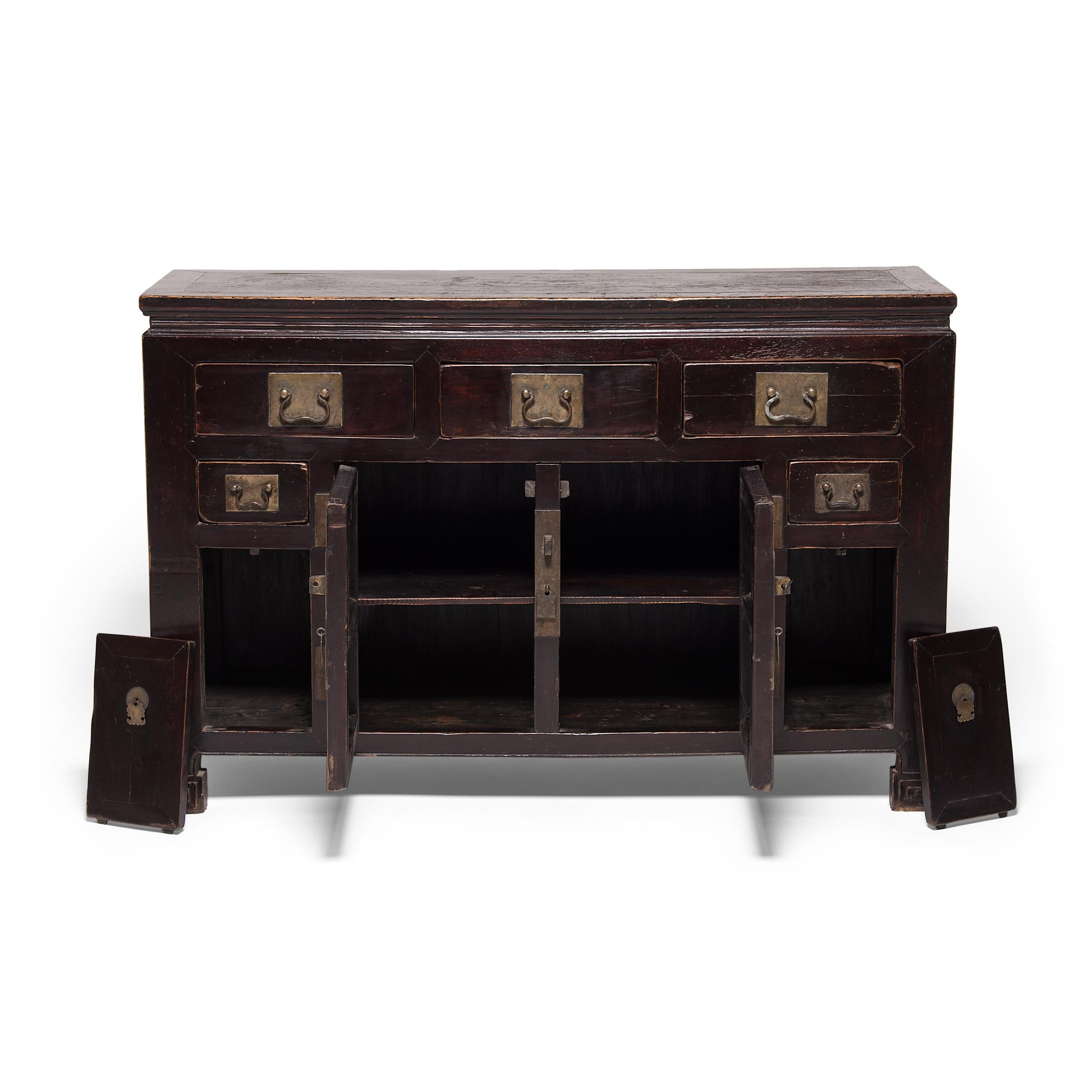 Centuries ago, this handsome coffer may have served as the family storage chest for embroidered silks or formal clothing. Crafted by a Qing-dynasty artisan in the bustling port city of Tianjin, the 19th century cabinet was likely commissioned as
