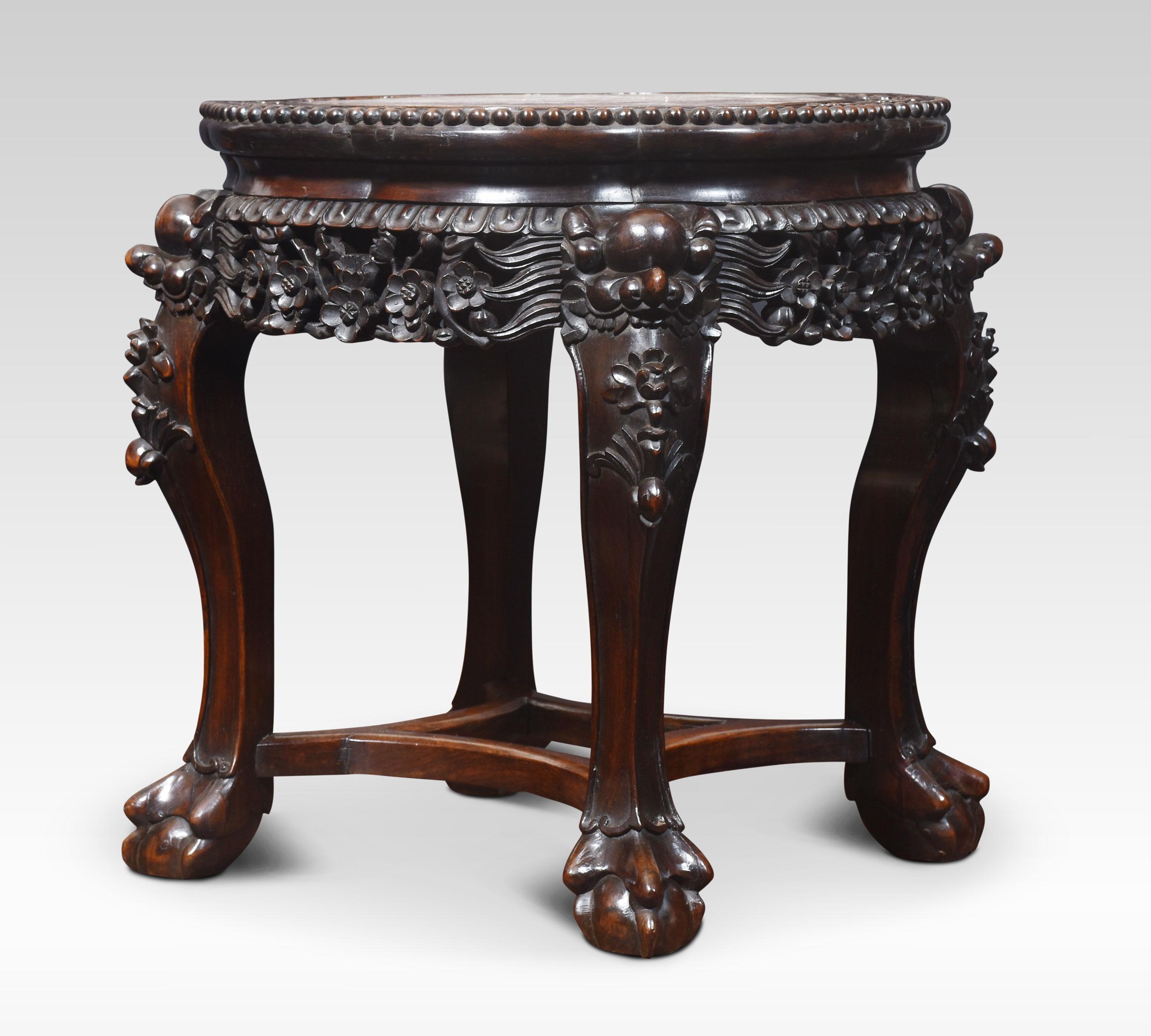 19th-century Chinese vase stand / wine table, the shaped top with inset marble, to the ornate carved pierced freeze. raised up on four shaped legs terminating in ball and claw feet, united by stretchers.
Dimensions
Height 18 Inches
Width 17