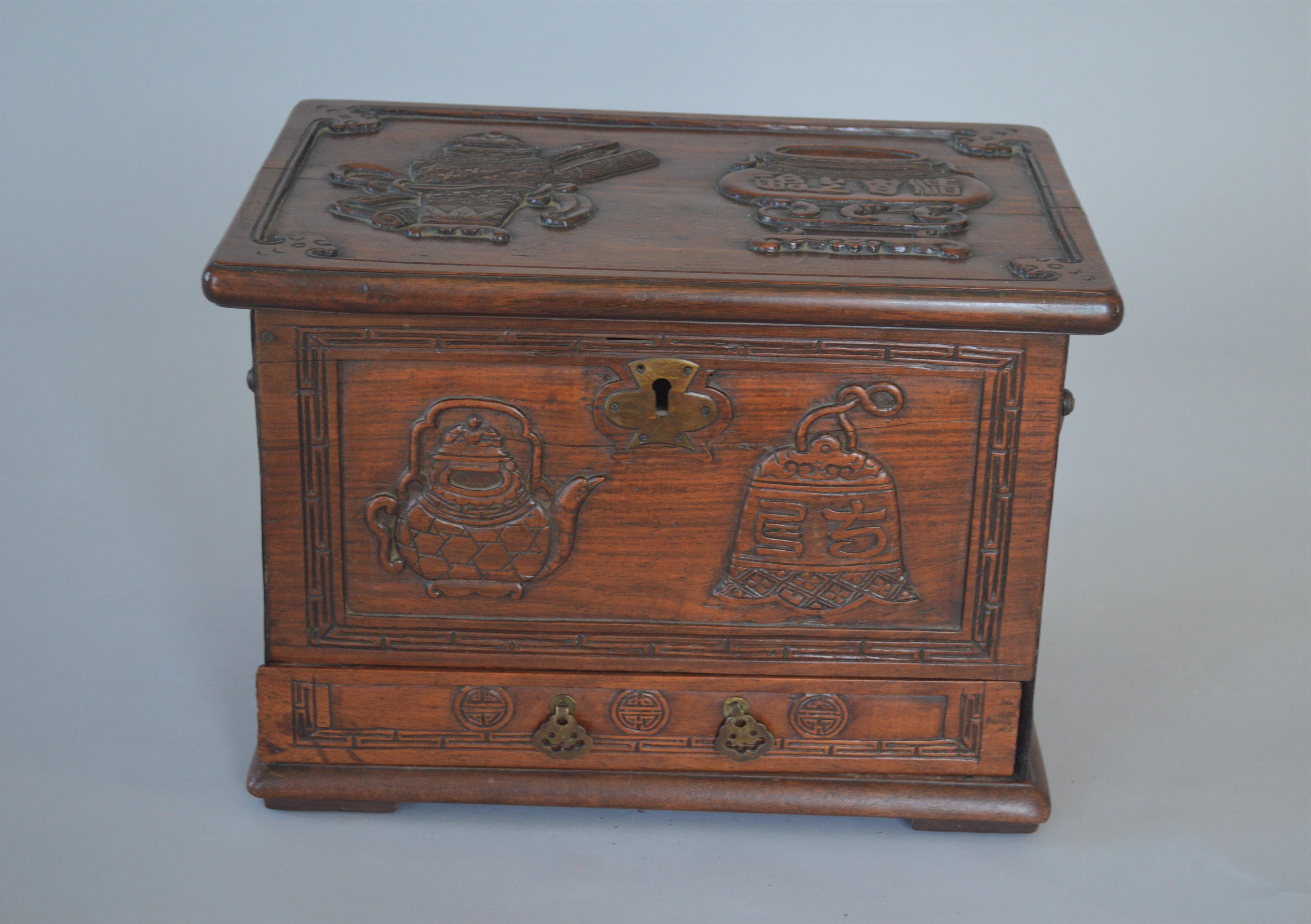 19th century Chinese wooden tea caddy or teabox, carved with symbols for tea. Open in top and also has a drawer. Proberbly Hong Mü.