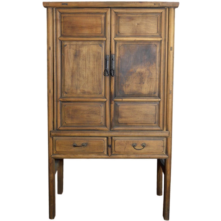 19th Century Chinese Wooden Wardrobe With Paneled Doors Drawers And 19th Century Chinese Wooden Wardrobe With Paneled Doors Drawers And Tall Legs For